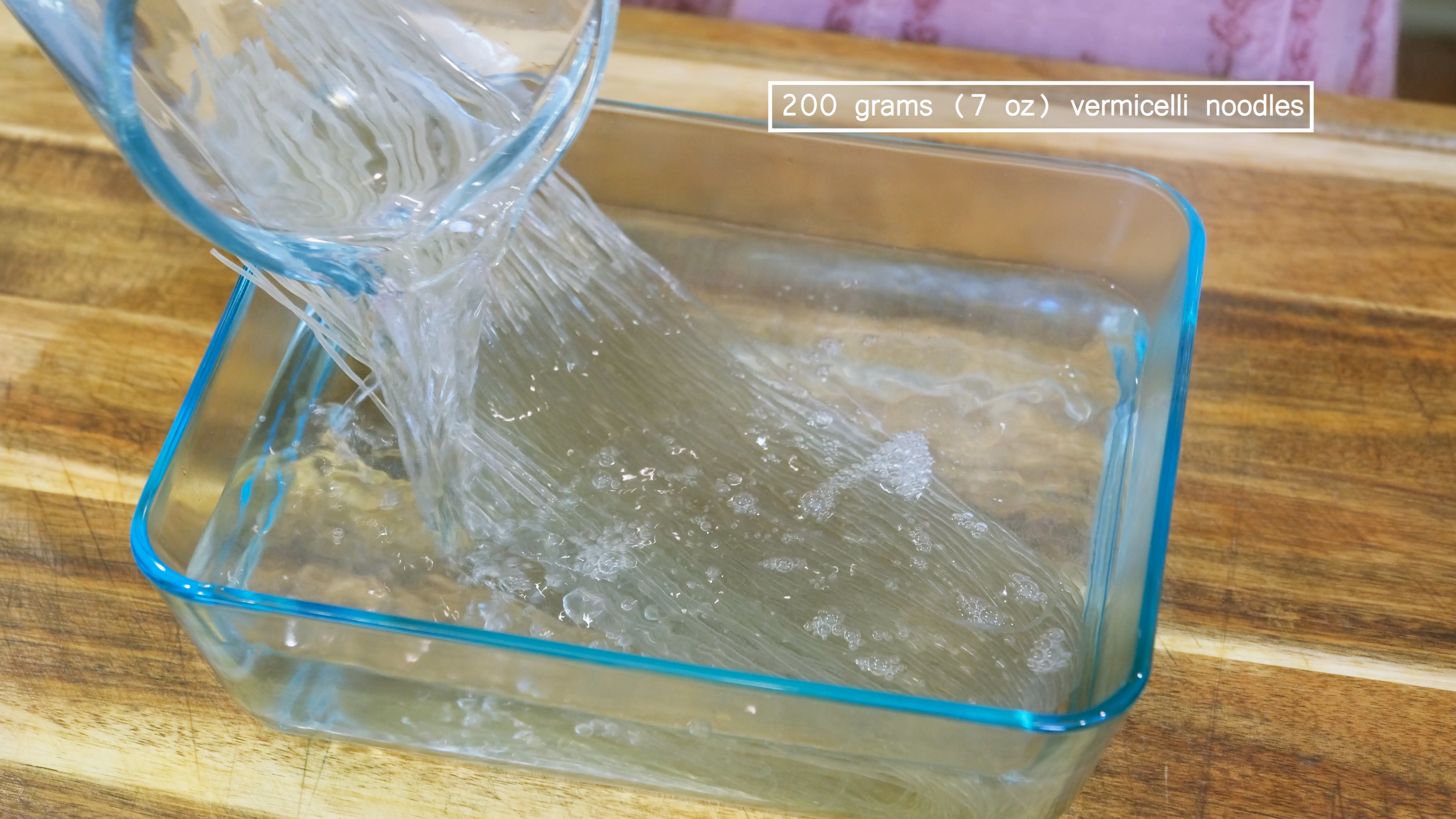 Image of Soak the vermicelli noodles in hot water for 10 minutes. 