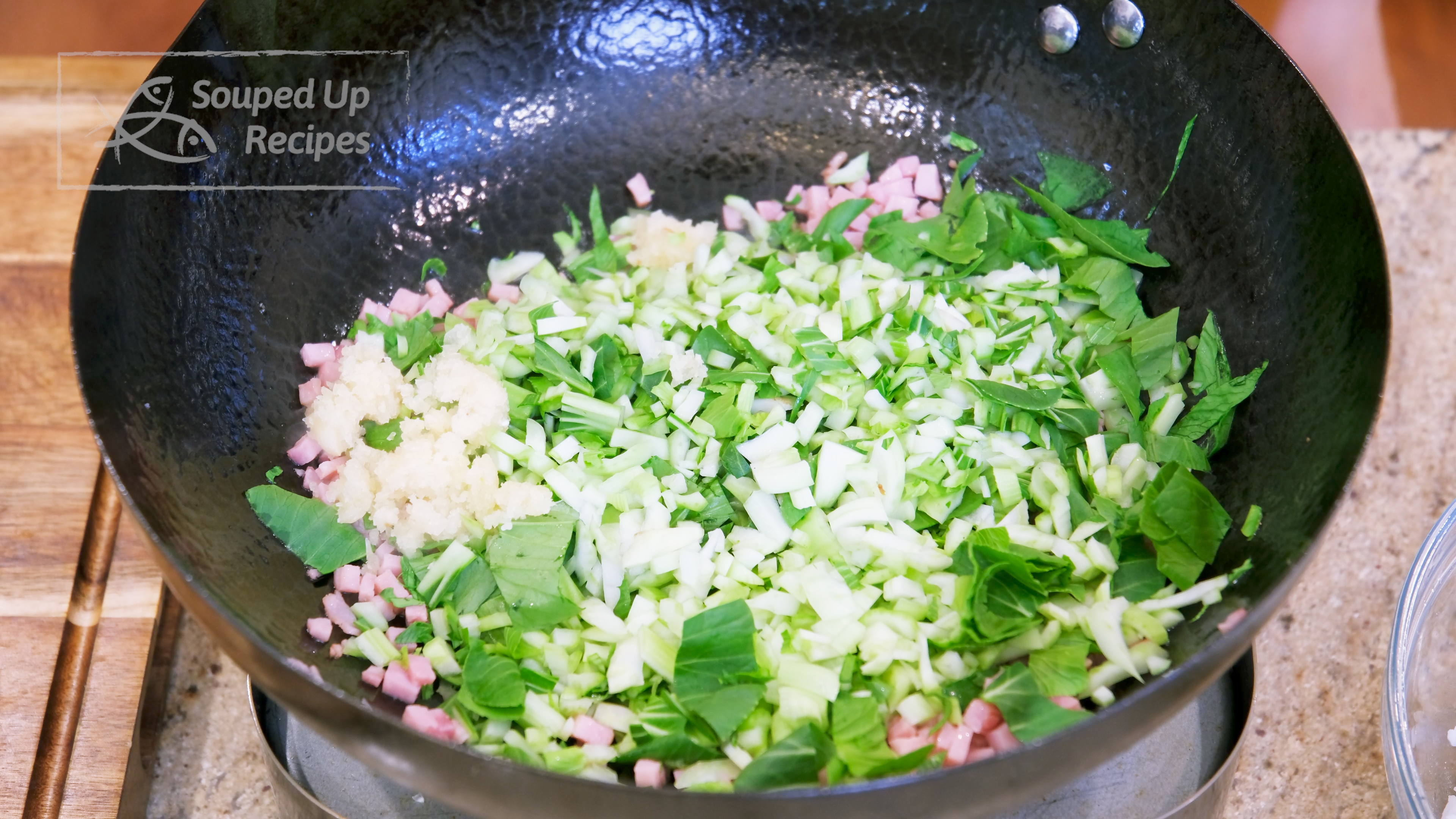 Image of Add the diced bok choy and 1.5 Tbsps of minced...