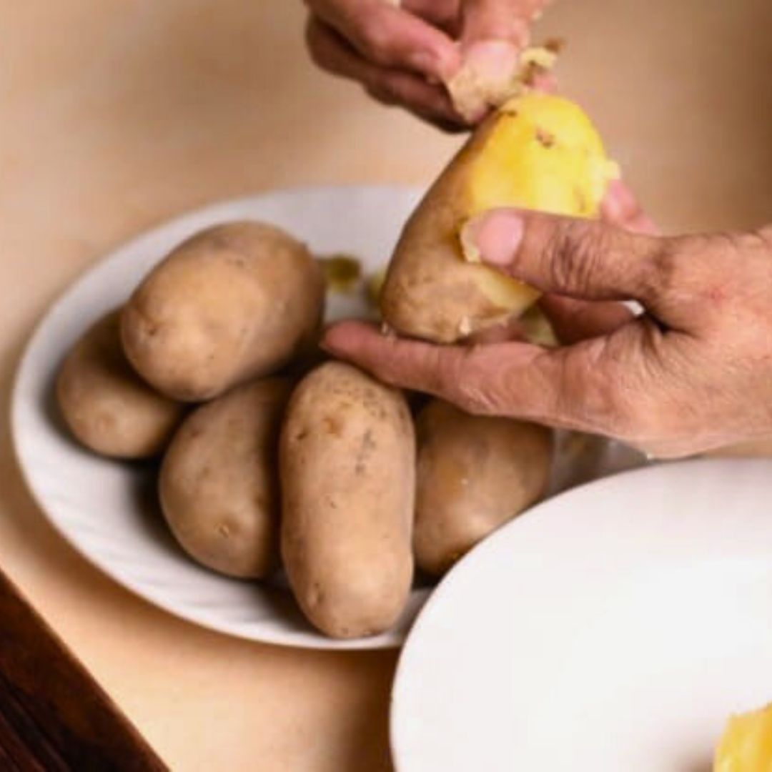 Image of Peel and mash the boiled potatoes lightly, keeping some texture...