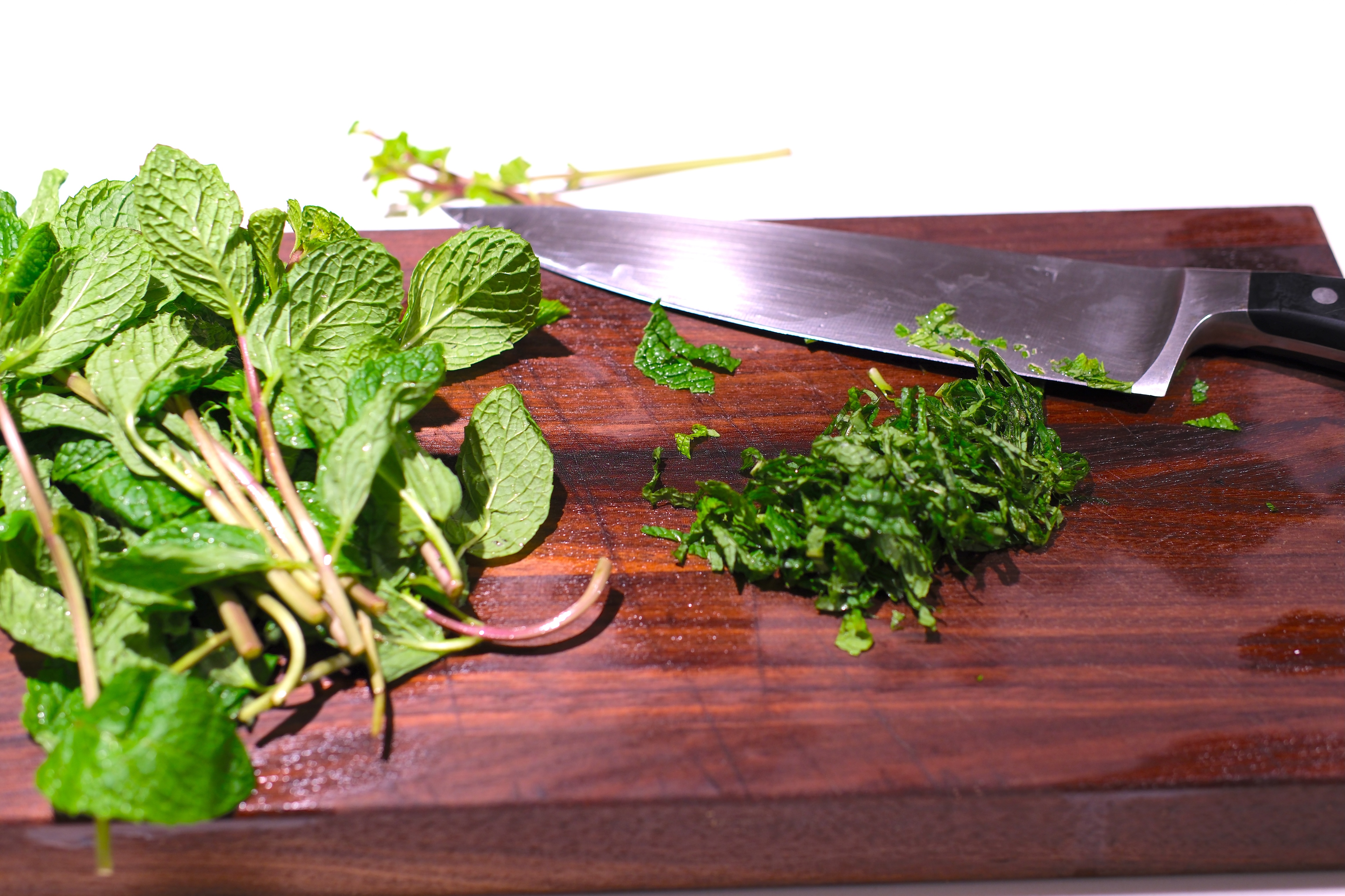 Image of Pluck mint leaves and thinly chop them (discard stems) and...