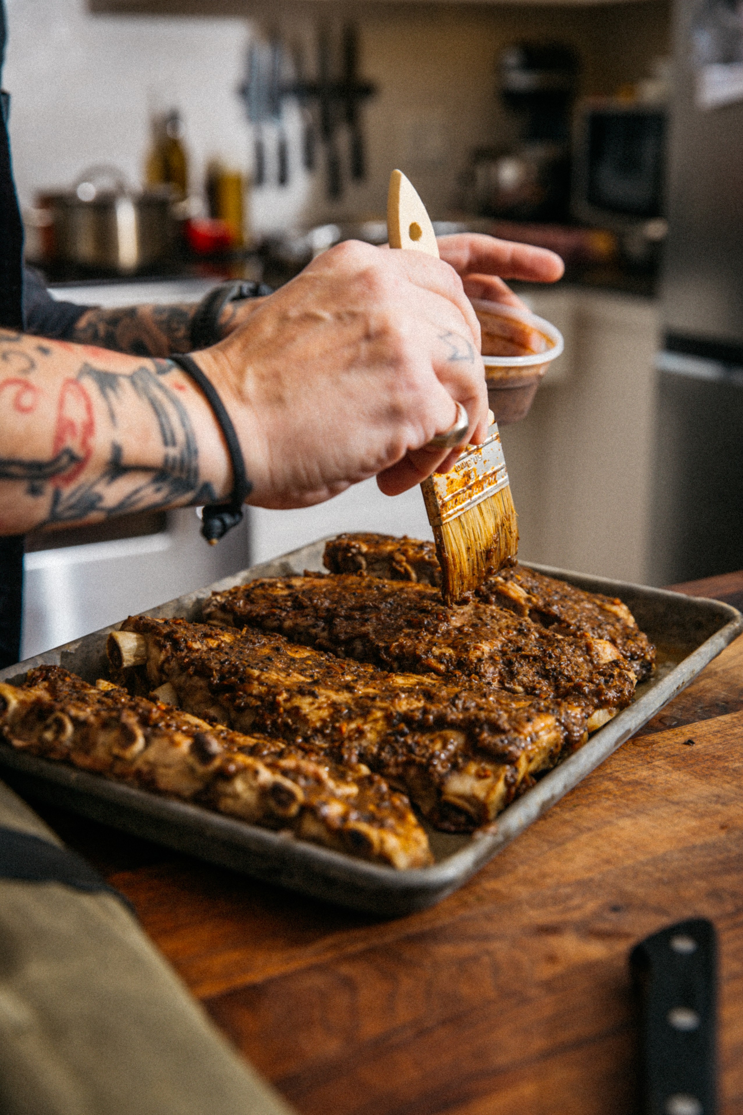 Image of Brush ribs with marinade on both sides, and place side-by-side...