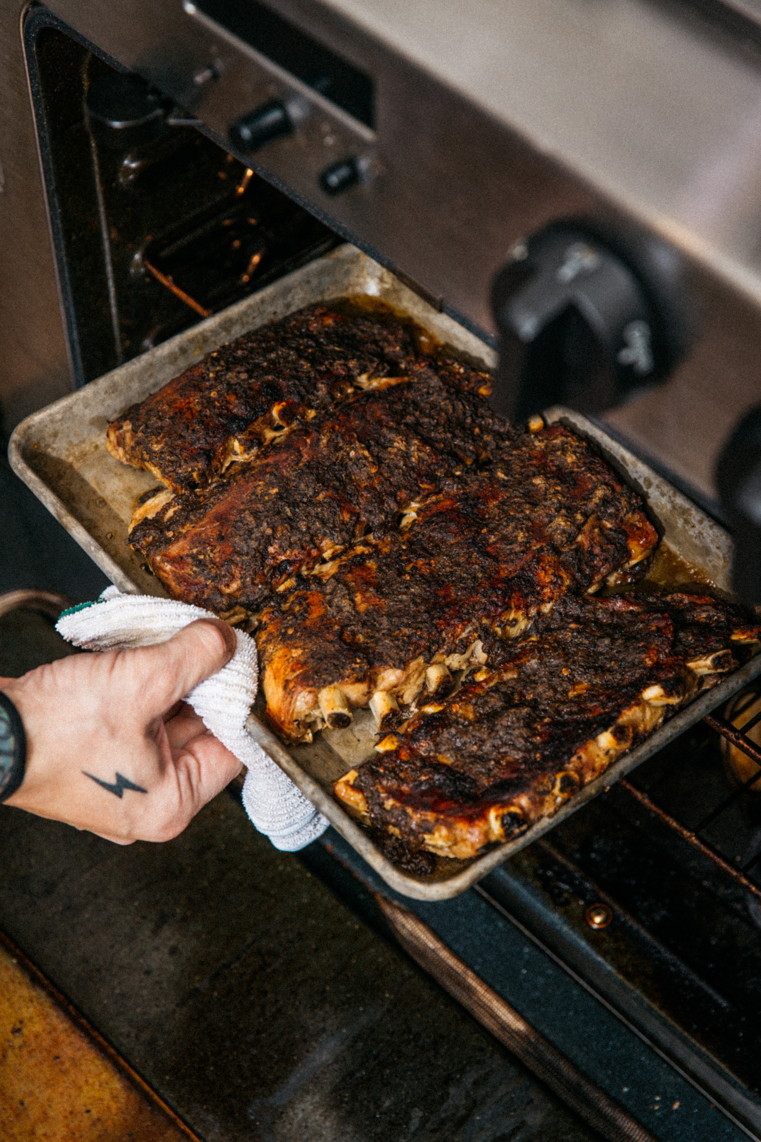 Image of Remove ribs from oven. (Meat should be tender, but still...