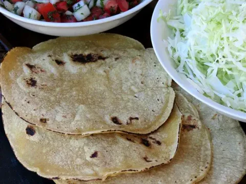 Image of Prep the cabbage, pico, avocado, limes, and tortillas, and set...