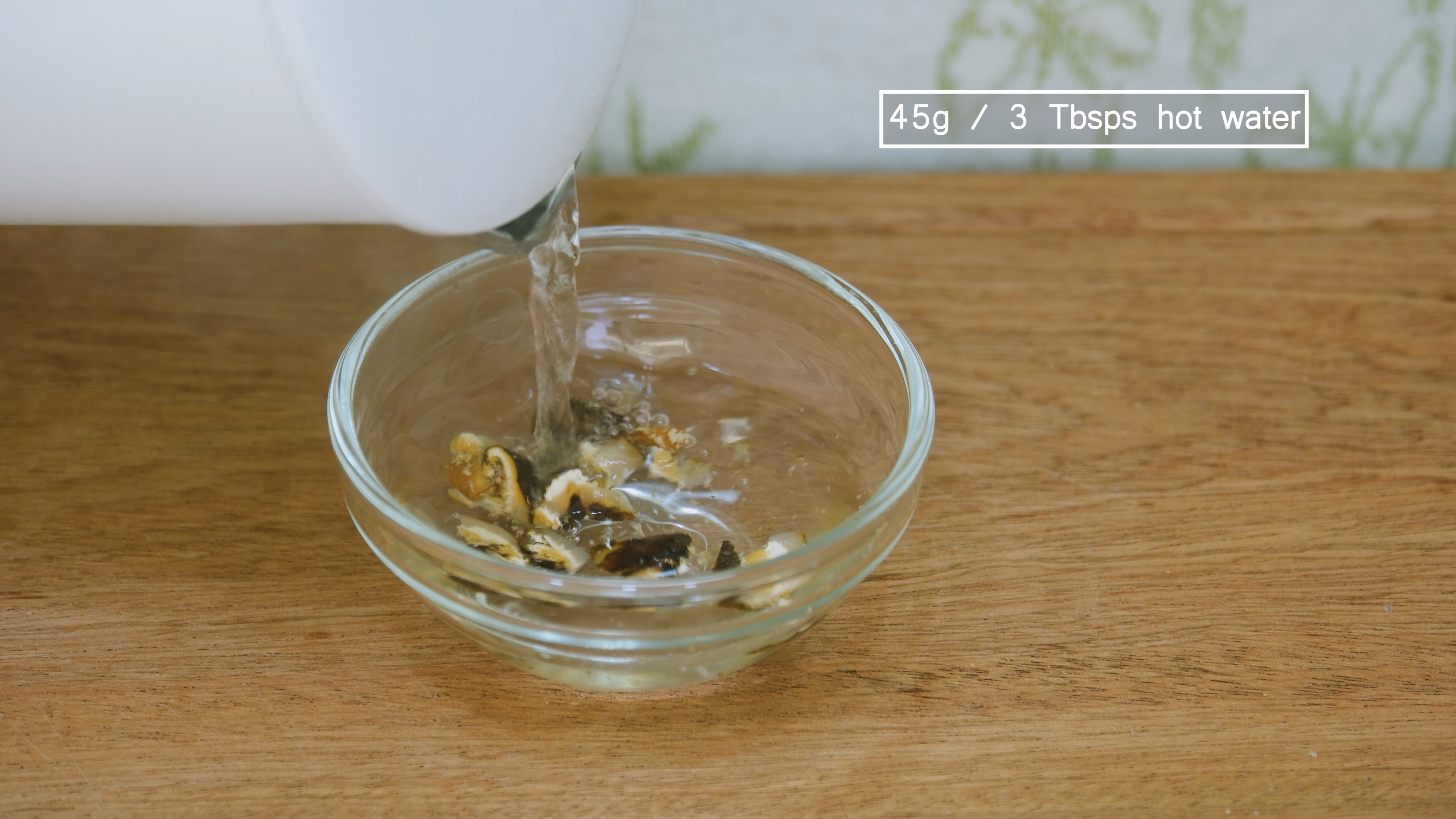 Image of Cut the dried shiitake mushroom into smaller pieces using kitchen...