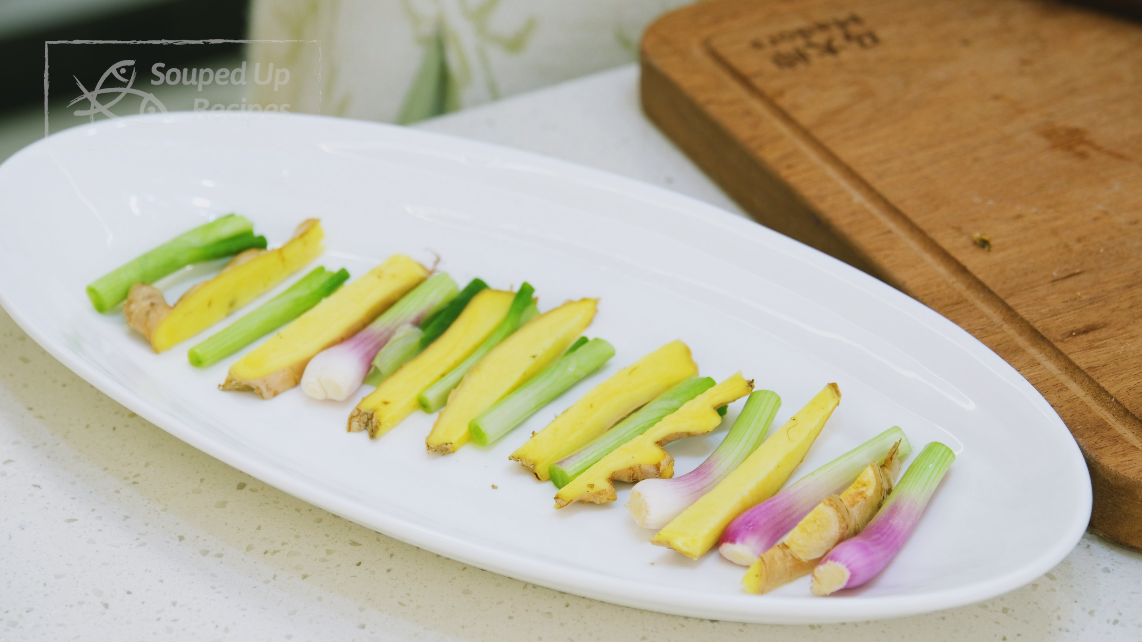 Image of Place the ginger strips and white parts of the scallion...