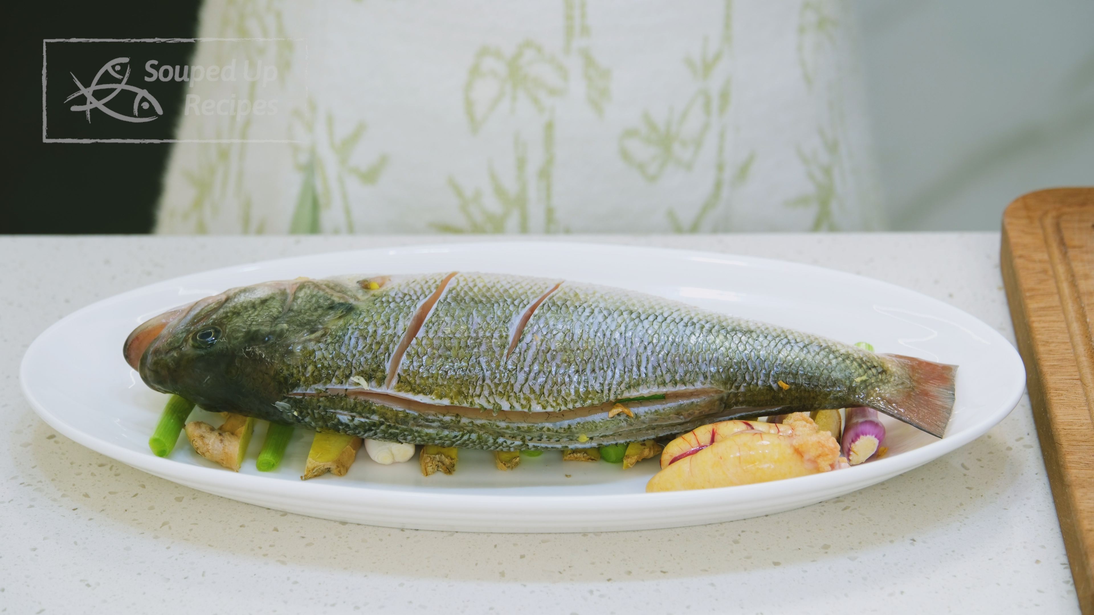 Image of Remove the aromatics from the fish and use paper towels...