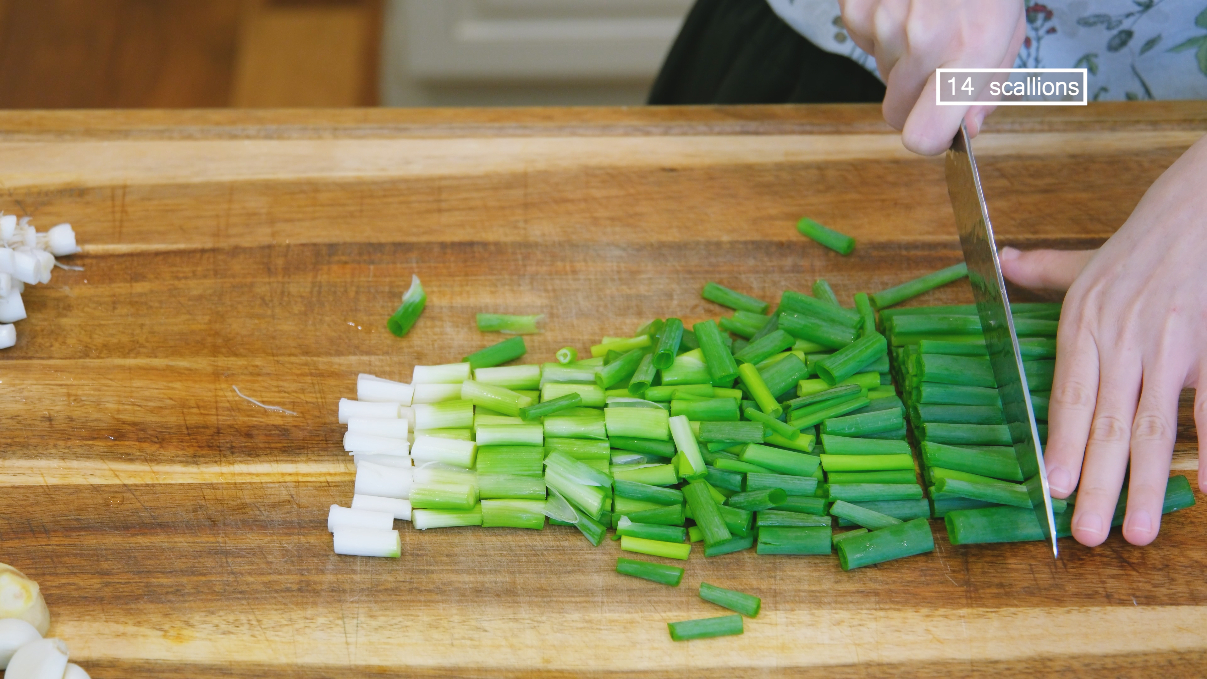 Image of While waiting, discard the scallion roots and dice the scallions...