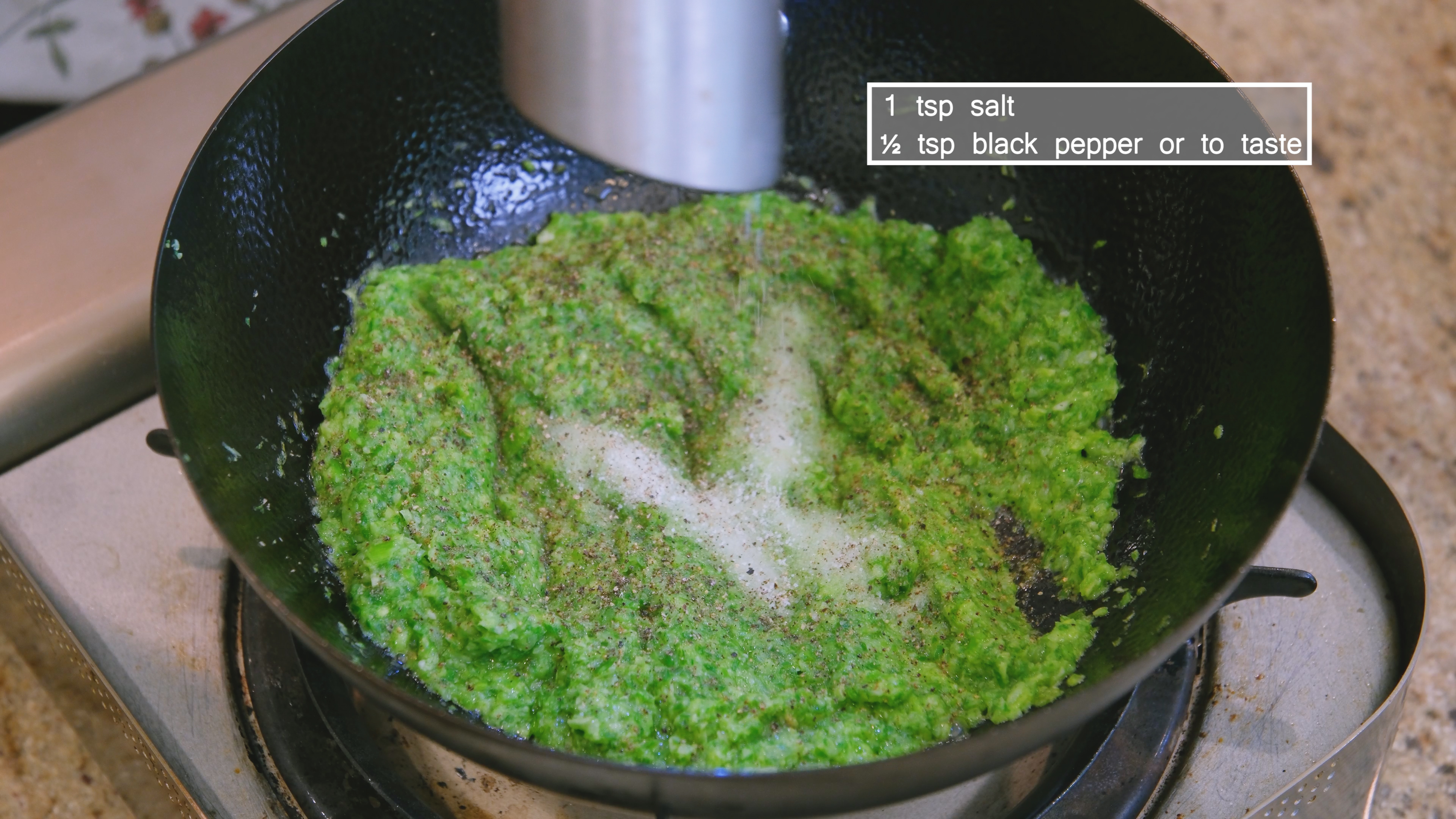 Image of Add the scallion paste to the wok and stir over...