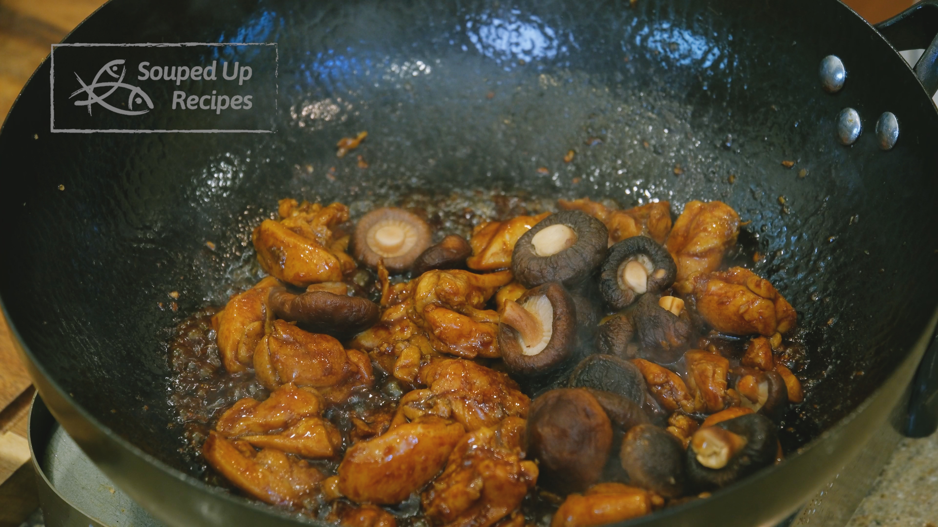 Image of Squeeze the soaked shiitake mushrooms, add them to the wok,...