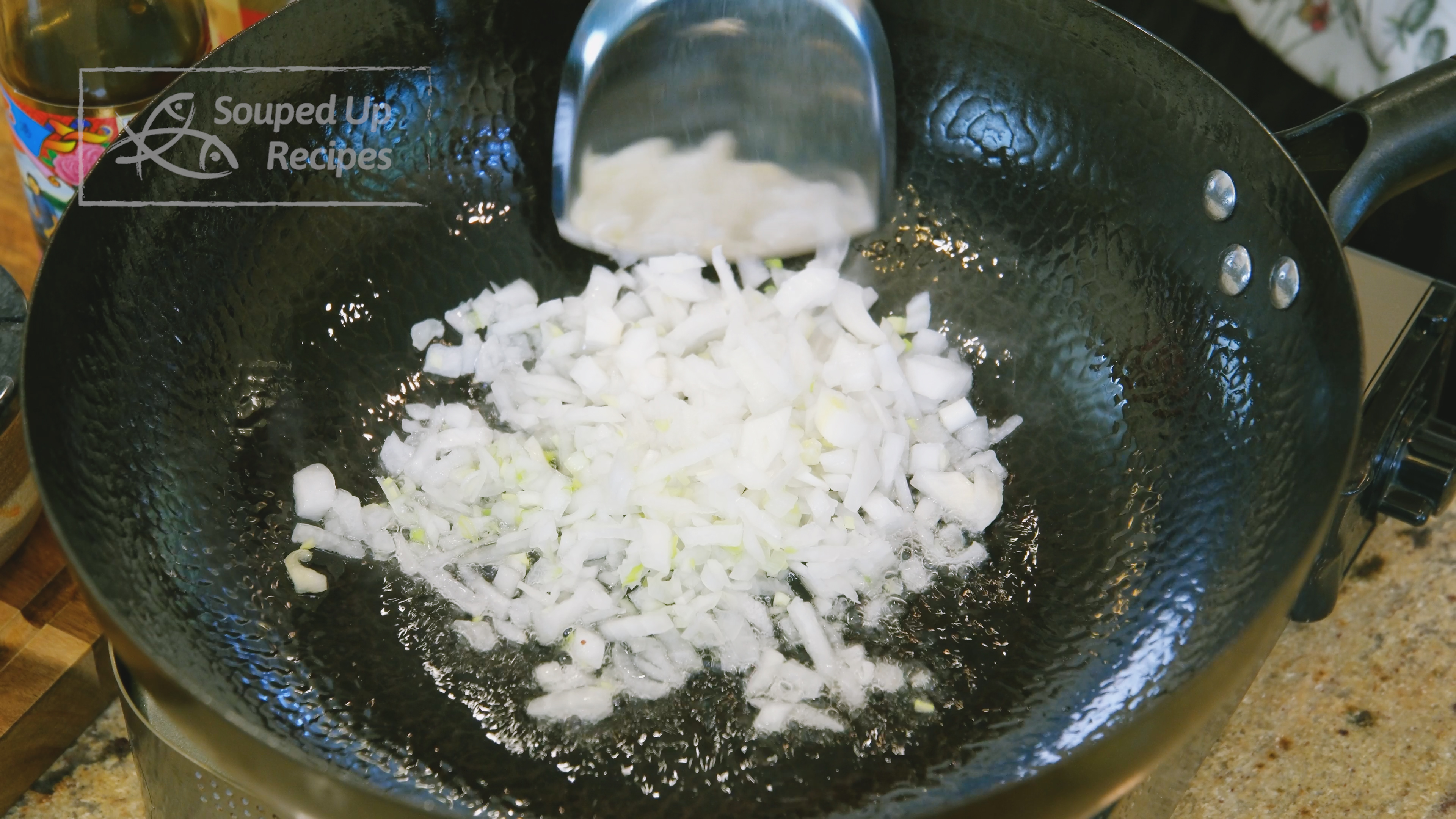 Image of Add oil and the diced onion to a wok and...