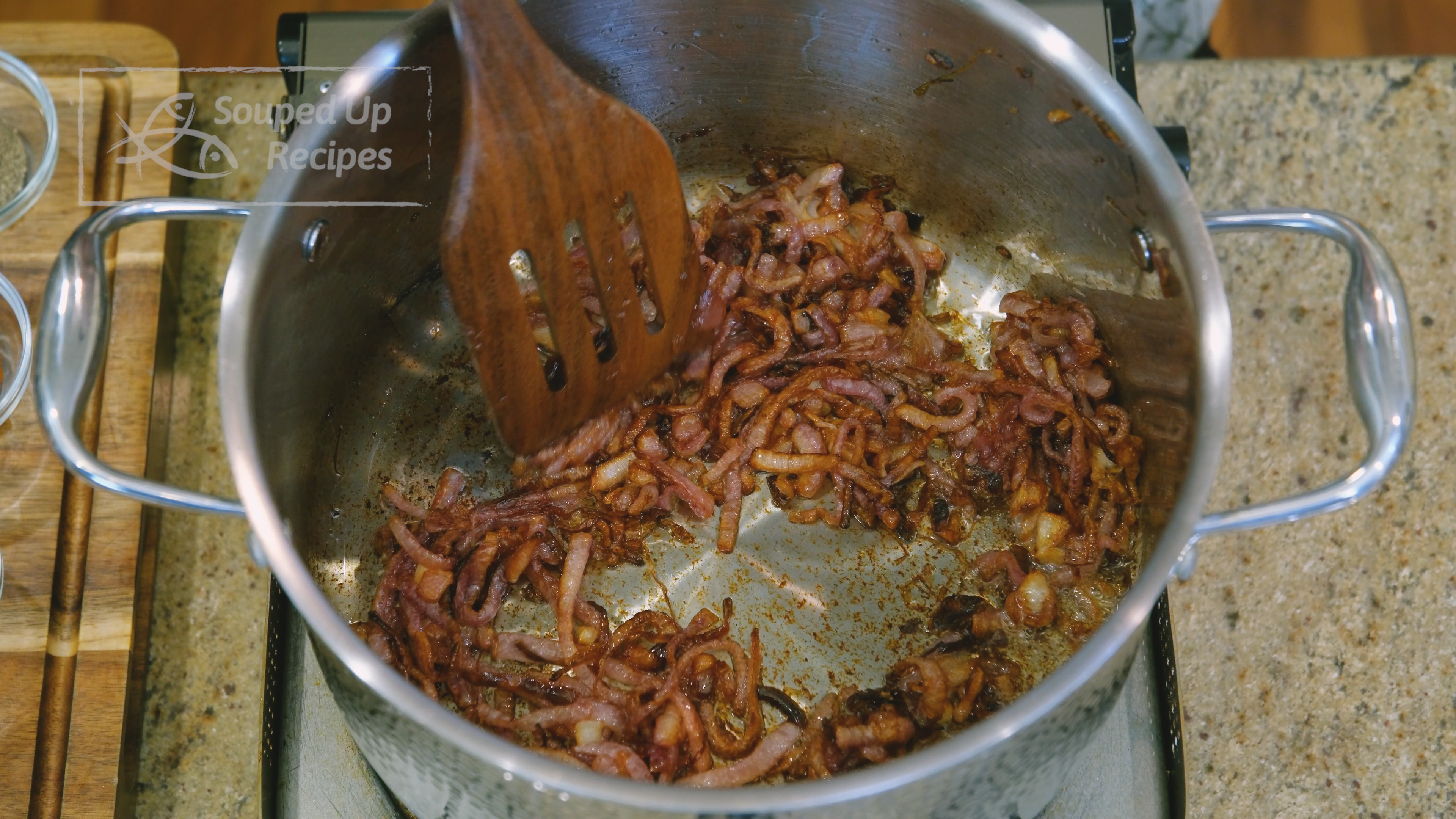 Image of Add the vegetable oil and the onion slices to a...