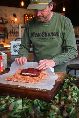 Image of Place the stuffed backstrap on one edge of the bacon...