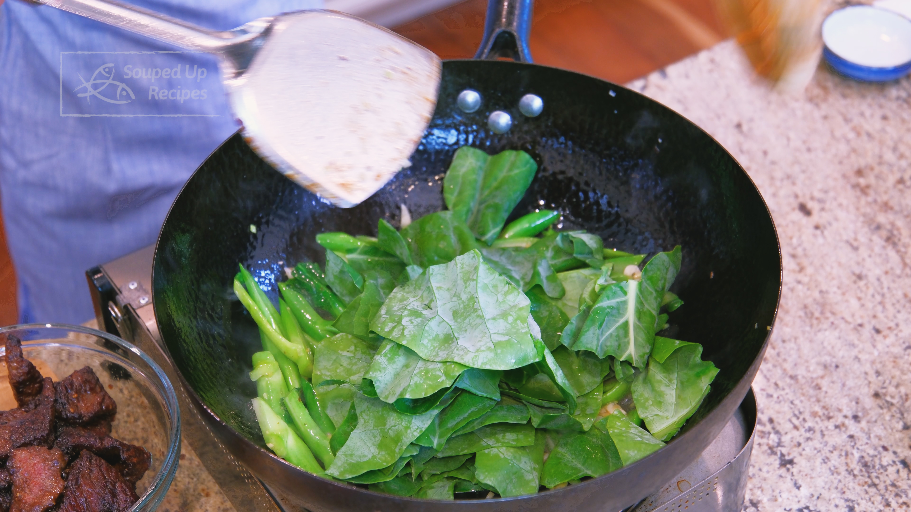 Image of Add the broccoli leaves and keep cooking until wilted.