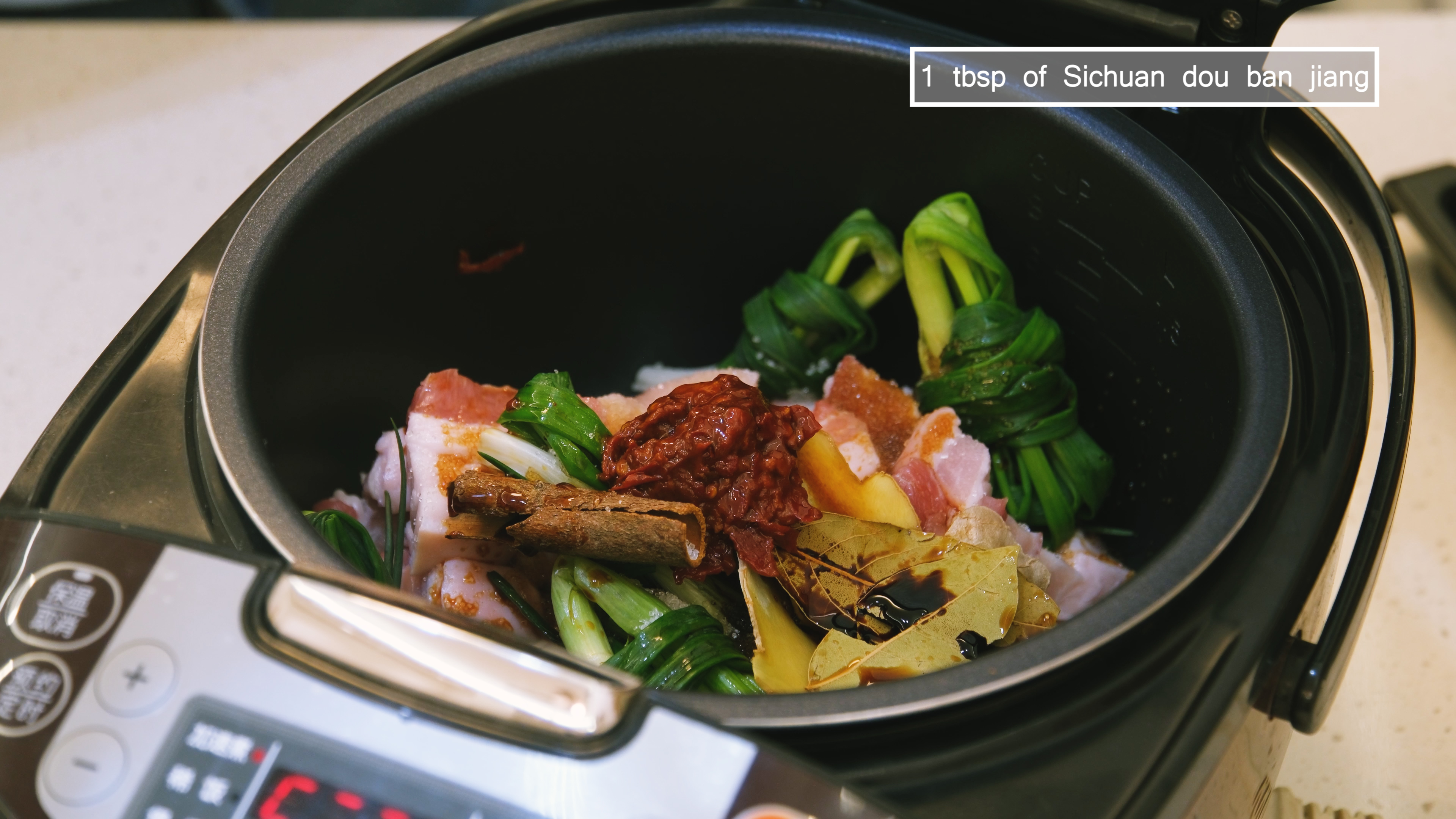 Image of Add the pork belly, scallions, garlic, ginger slices, cinnamon stick,...