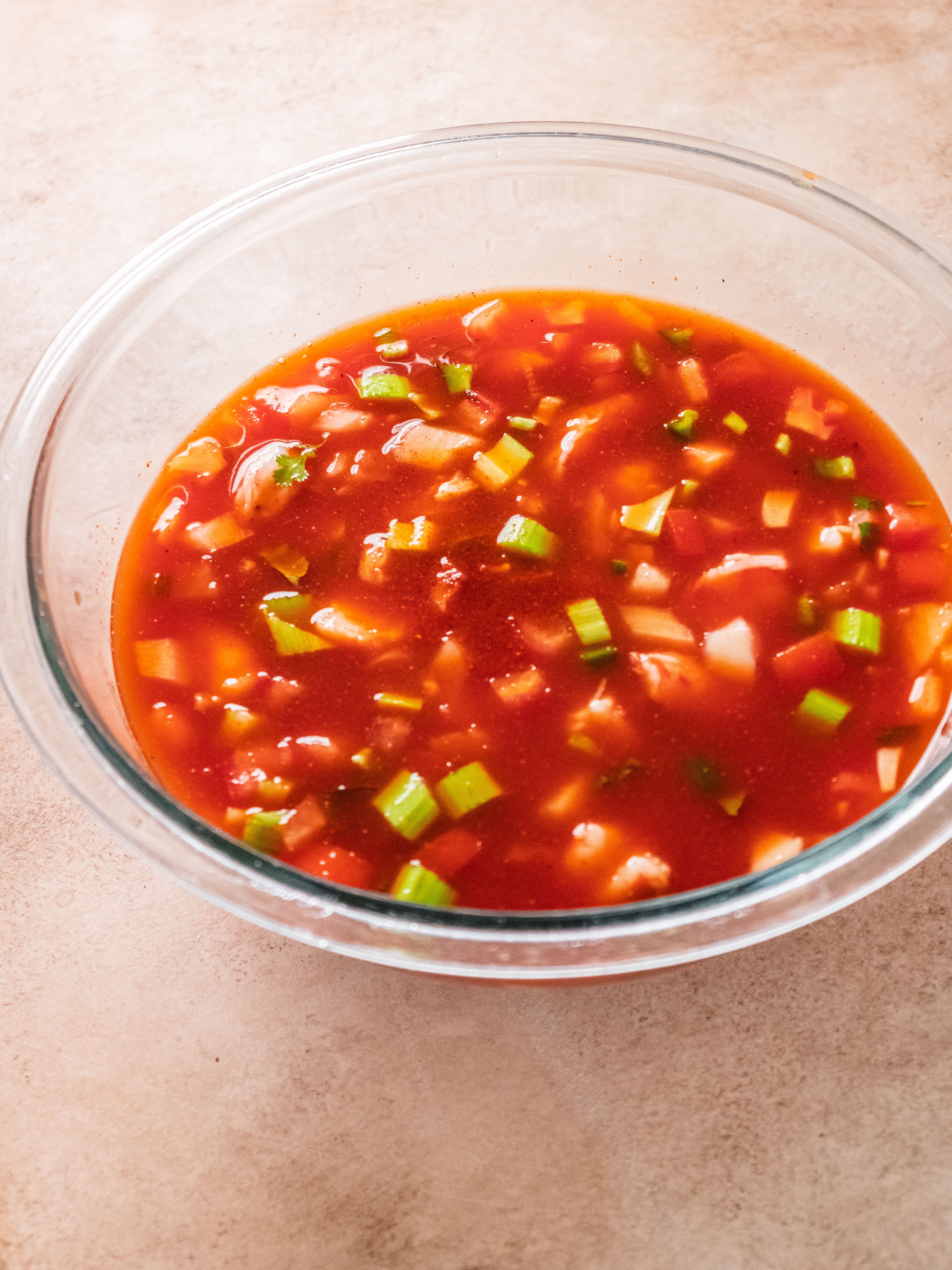 Image of In a large bowl, combine tomato juice, diced tomato, celery,...