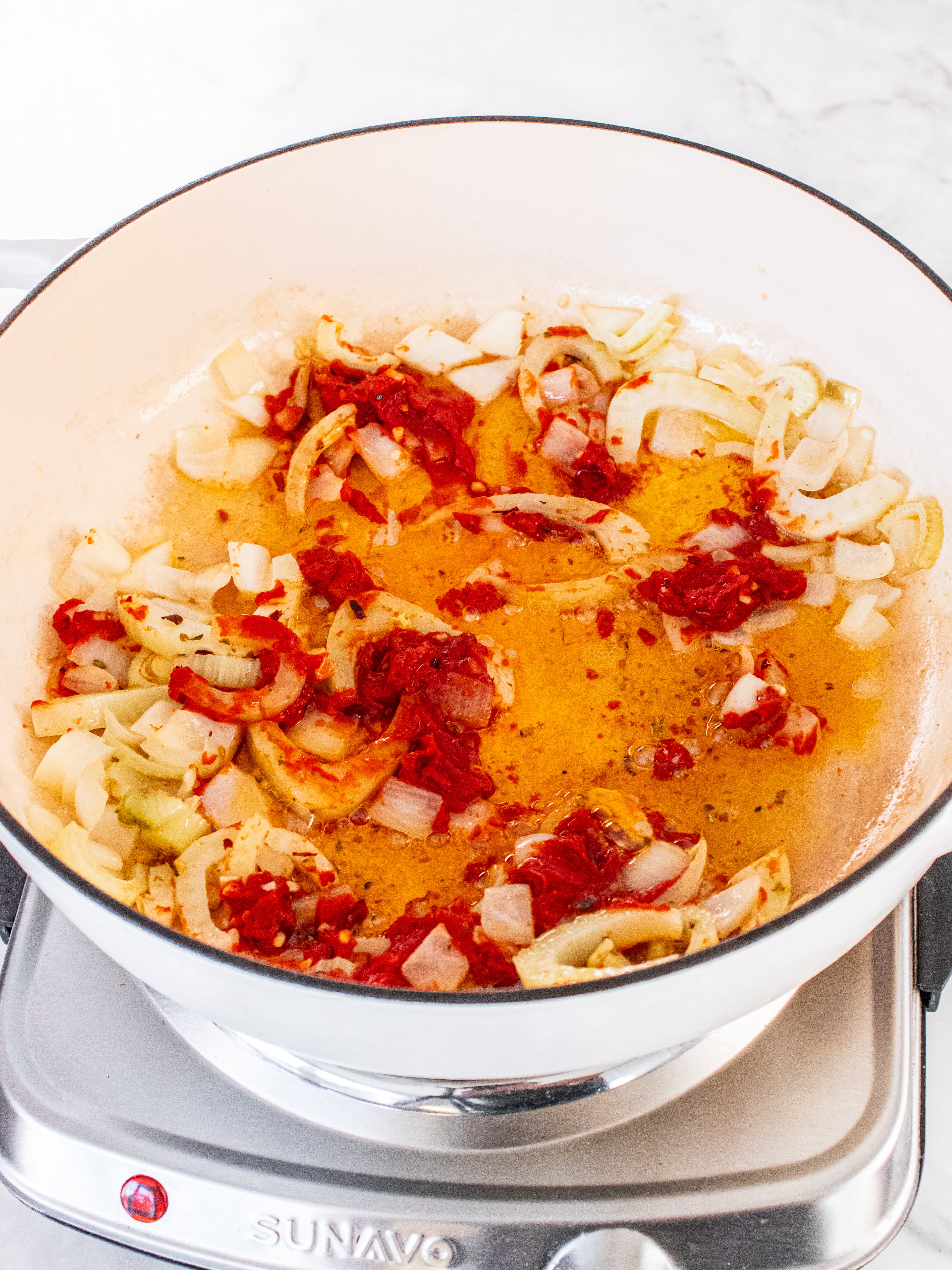 Image of Add garlic, tomato paste, oregano, and red pepper flakes. Cook...