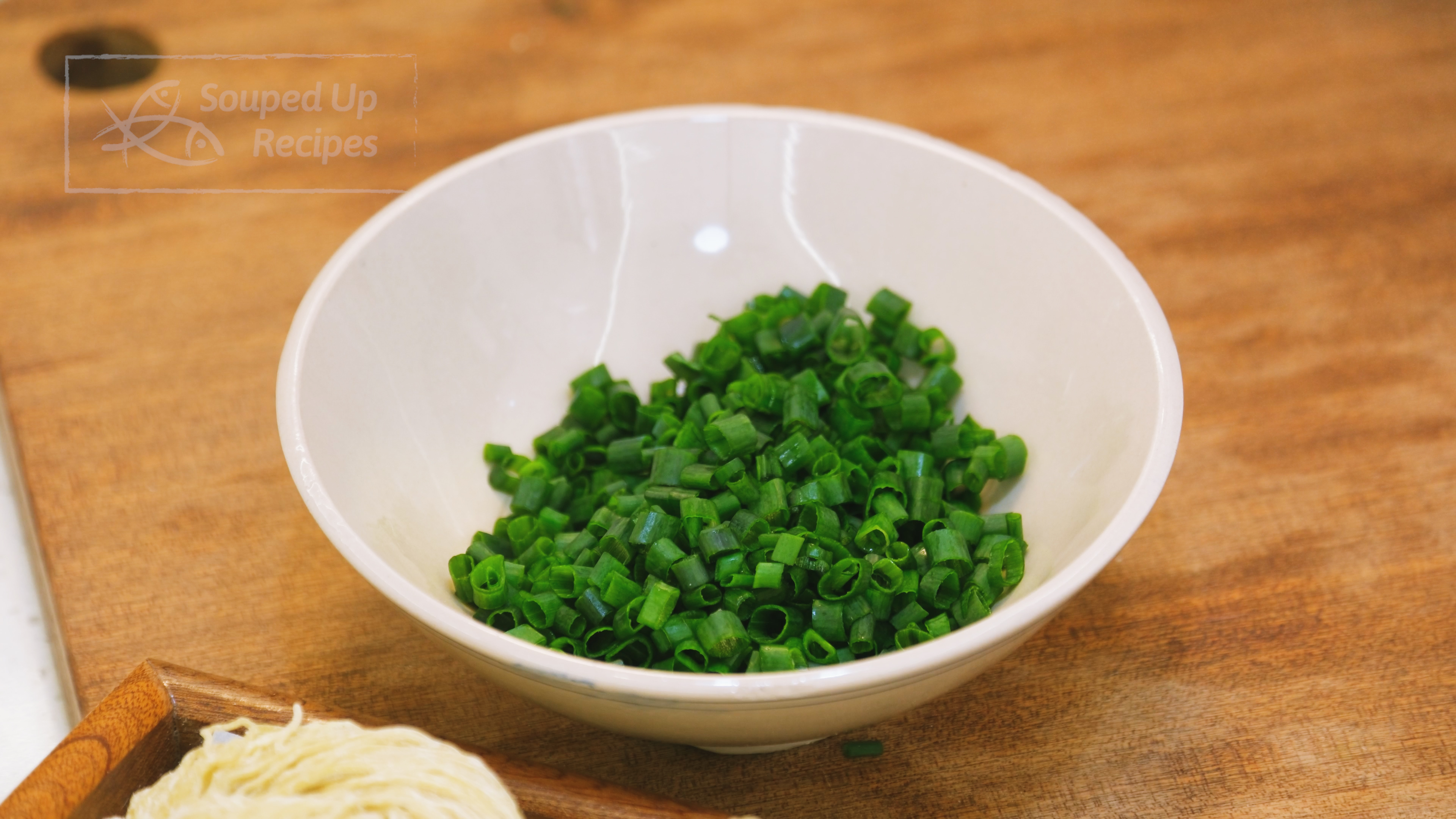 Image of Cut the scallions in half. Dice the green tops and...