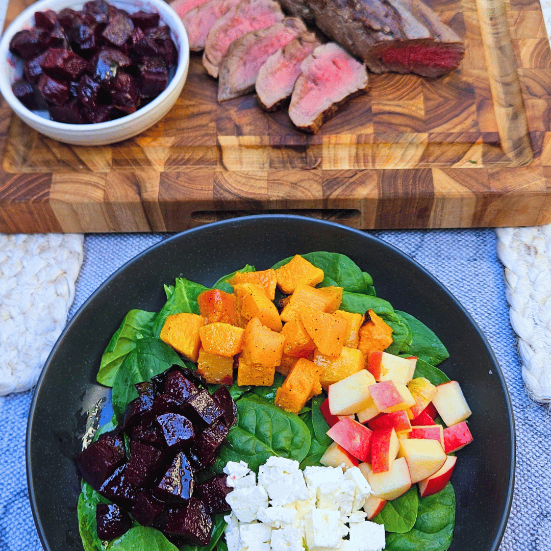 Image of Assemble the salad by placing a handful of the baby...
