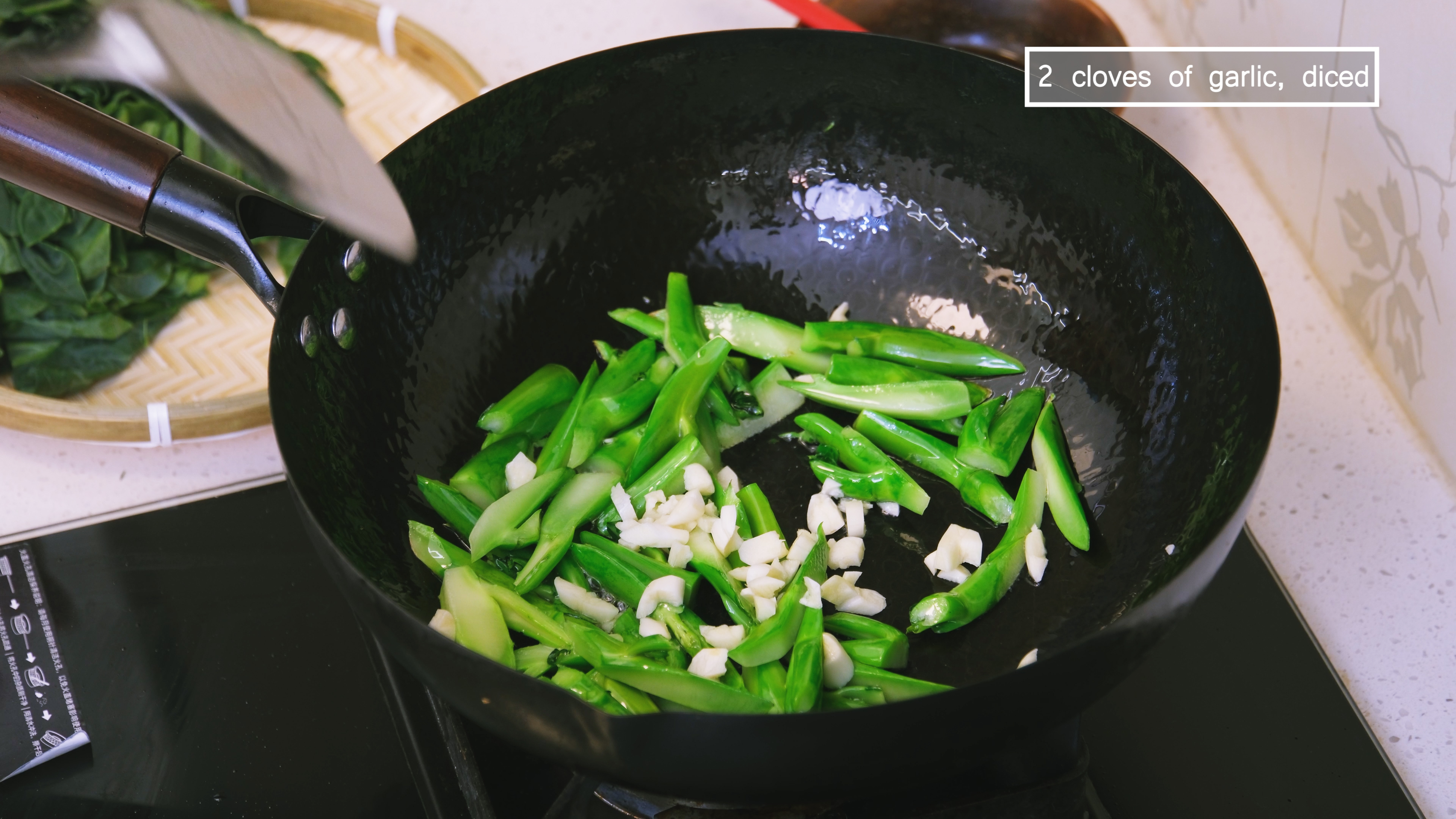 Image of Turn the heat to medium and preheat the wok for...