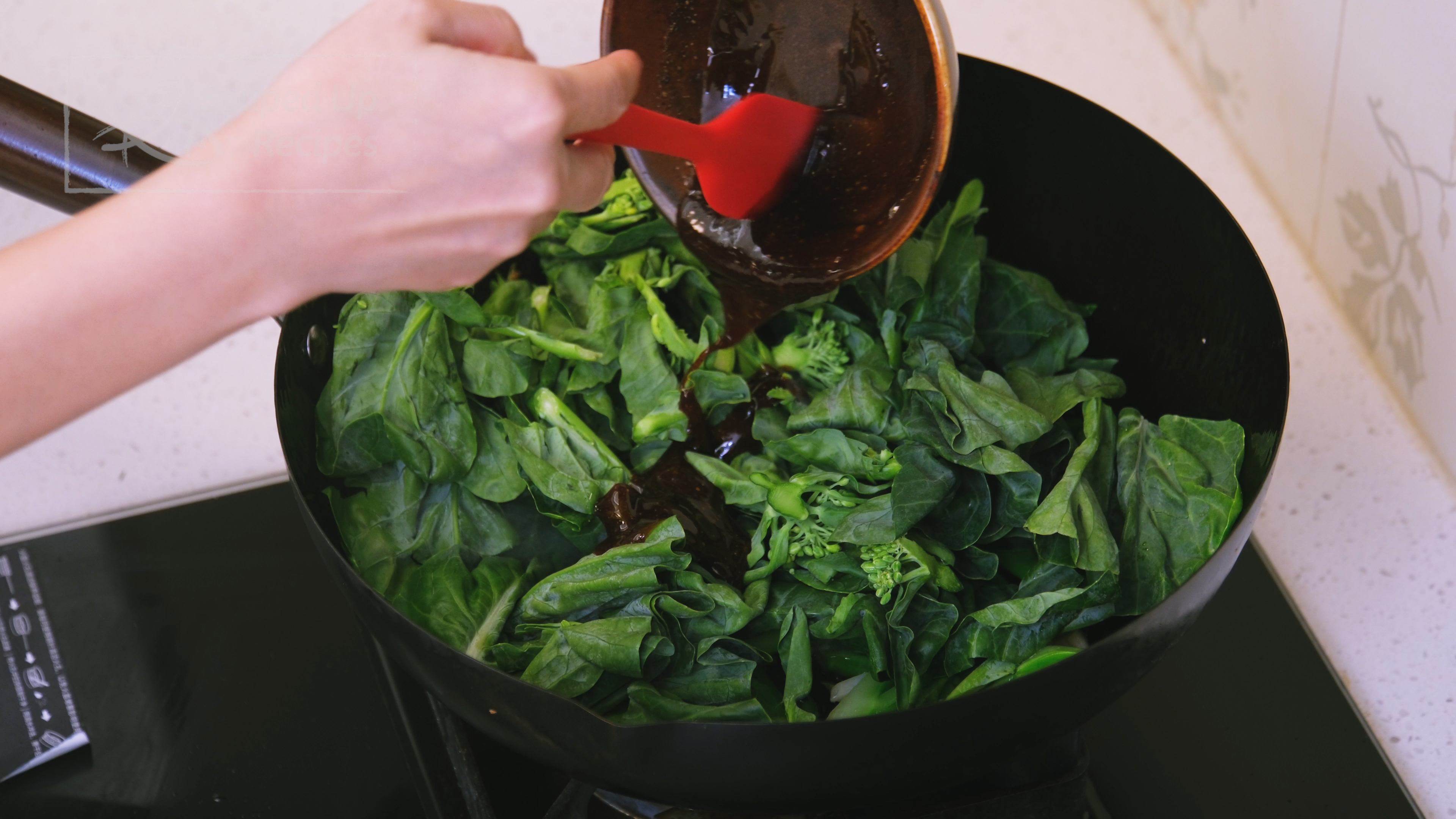 Image of Add the gailan leaves and pour in the sauce. Continue...