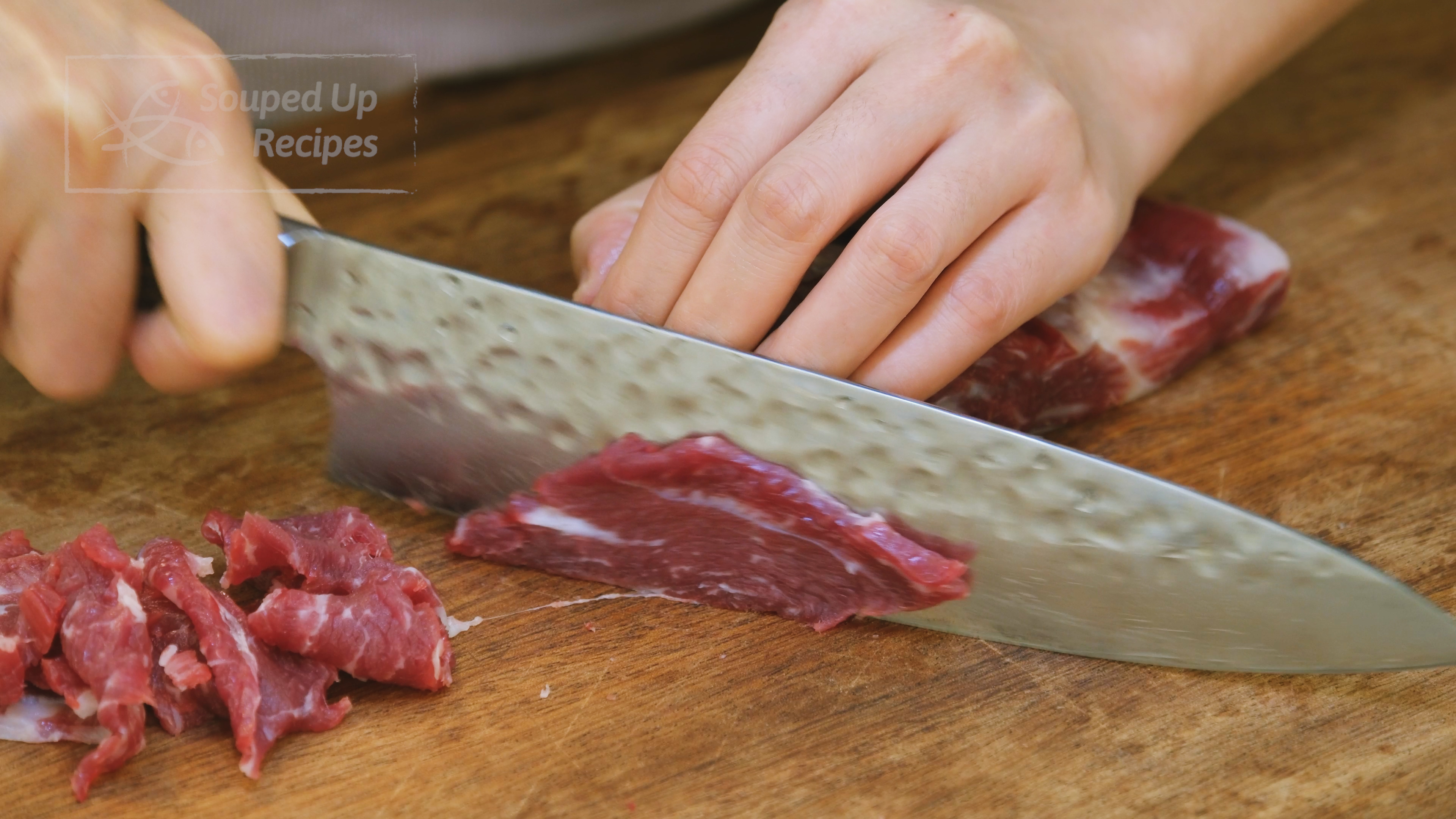 Image of Slice the beef into 1/8 of an inch thick pieces....