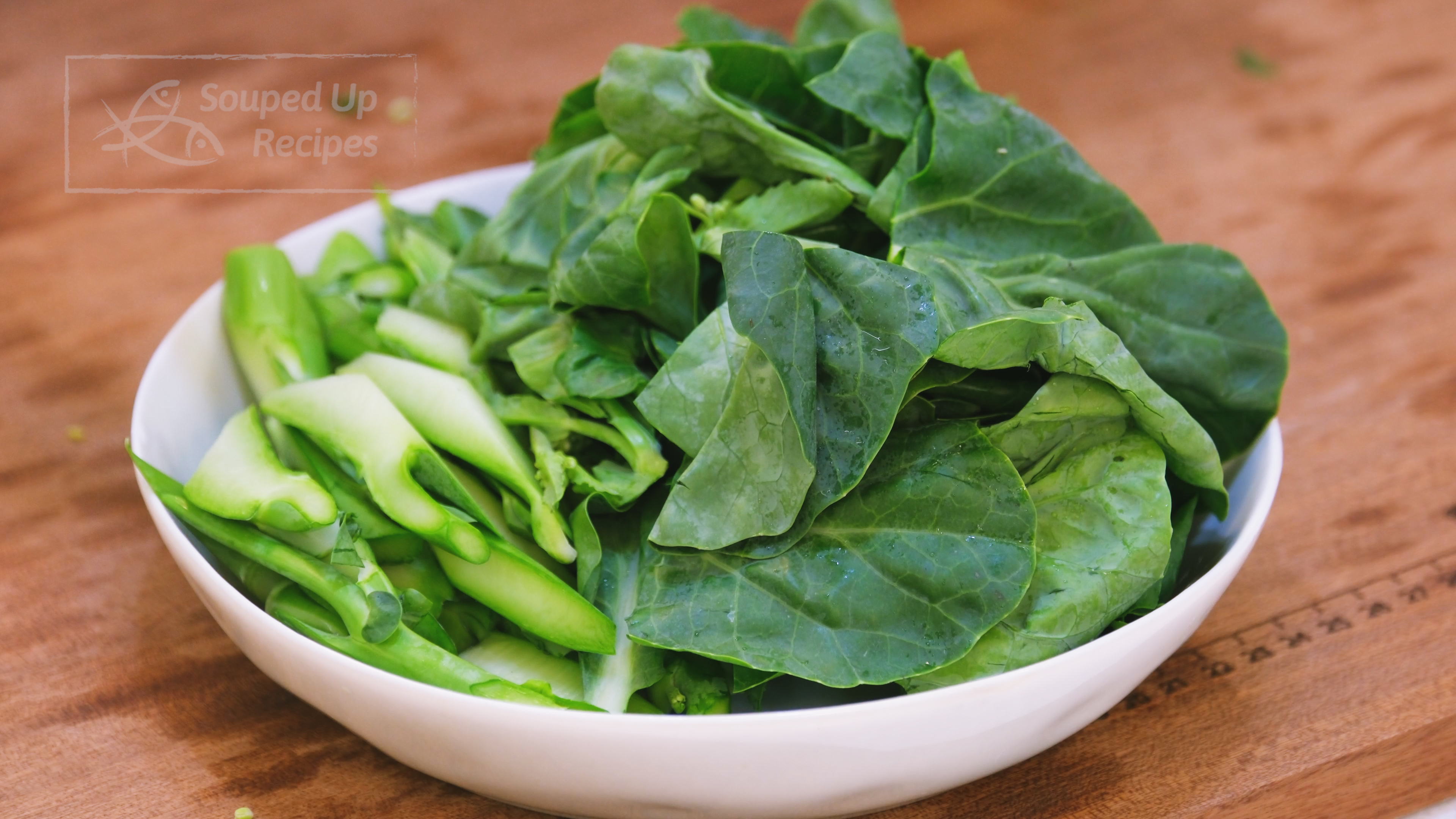 Image of During this time, separate the gailan (Chinese broccoli) stems and...
