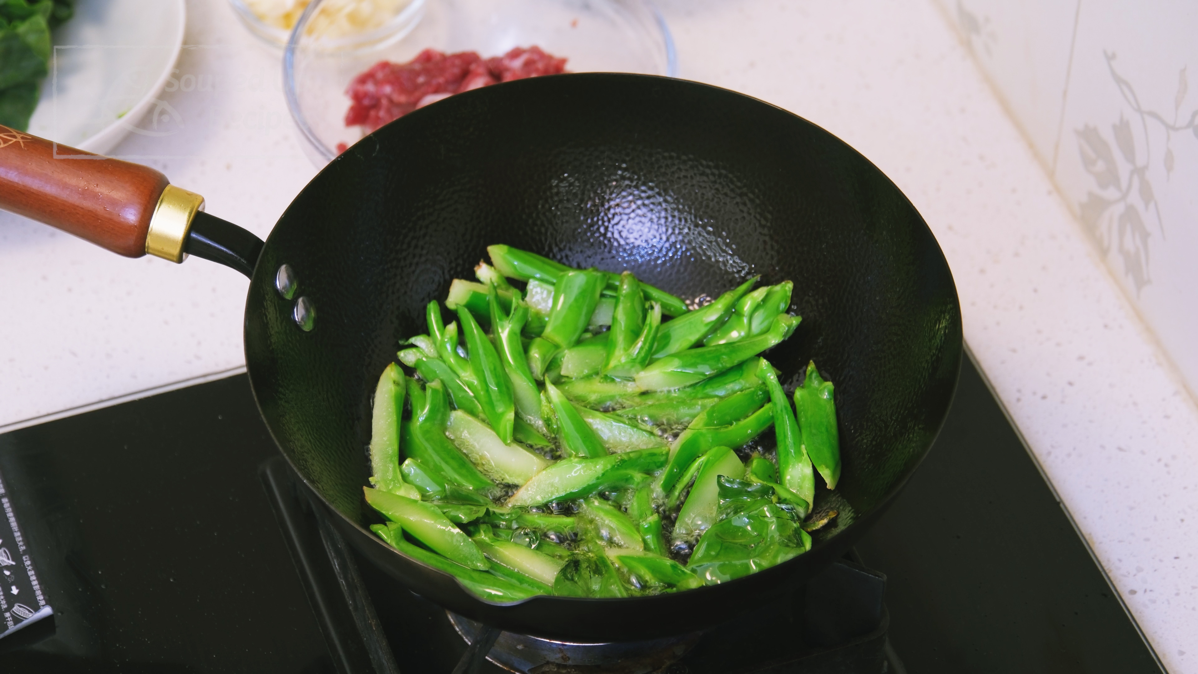 Image of Turn the heat to high and preheat the wok until...