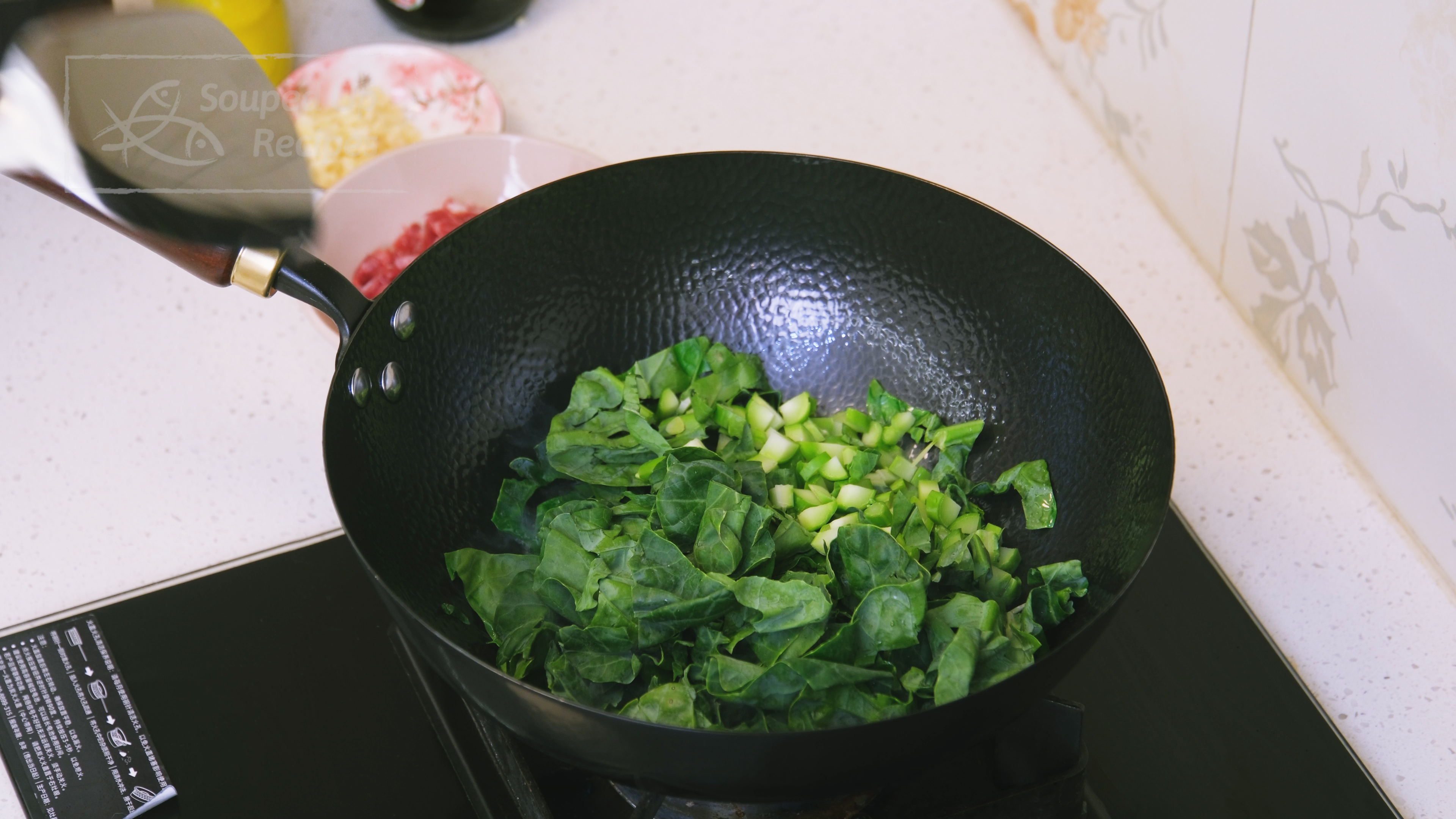Image of Turn the heat to high and preheat the wok until...