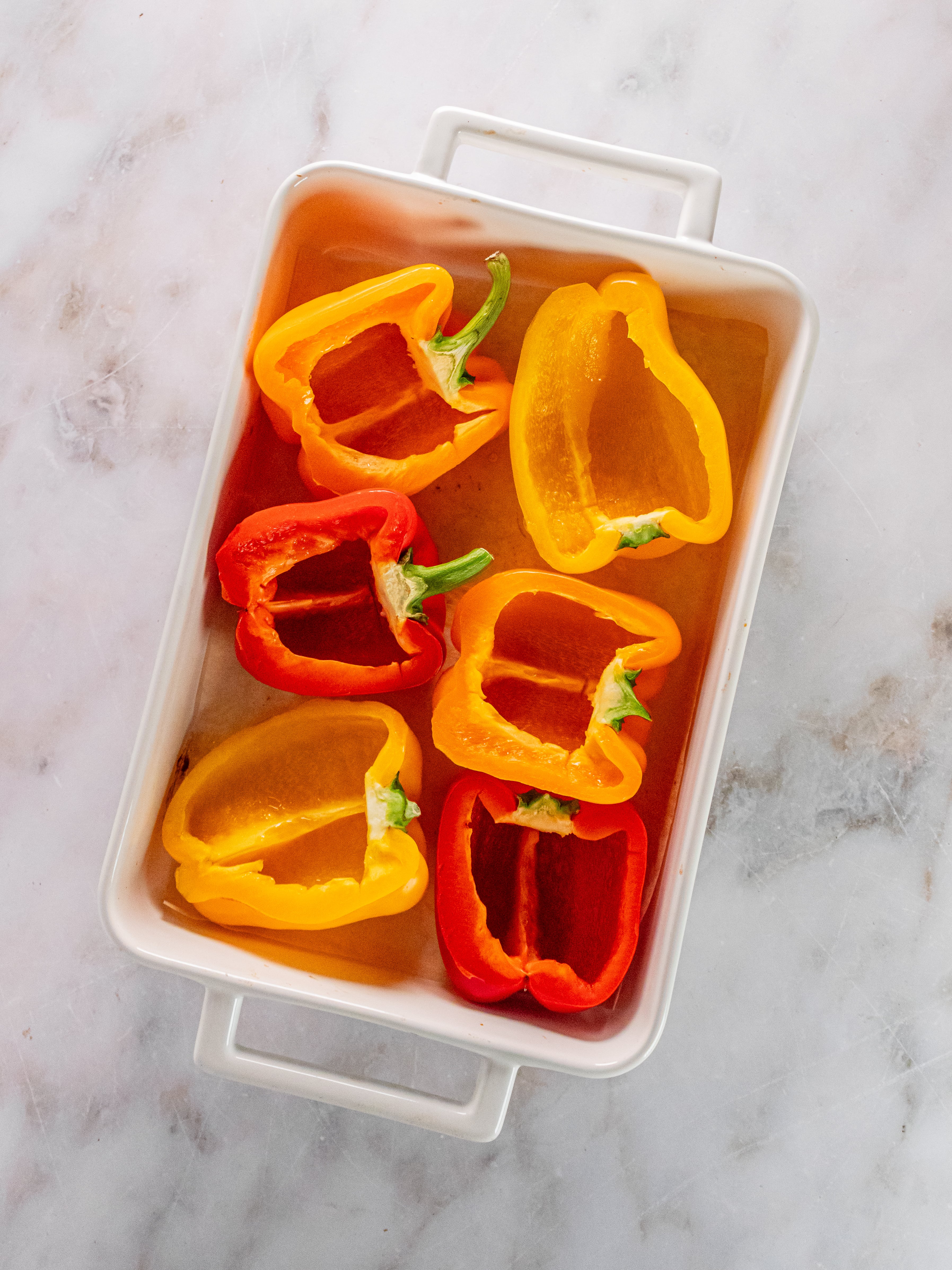 Image of Place peppers cut side down in casserole dish.&nbsp; Bake for...