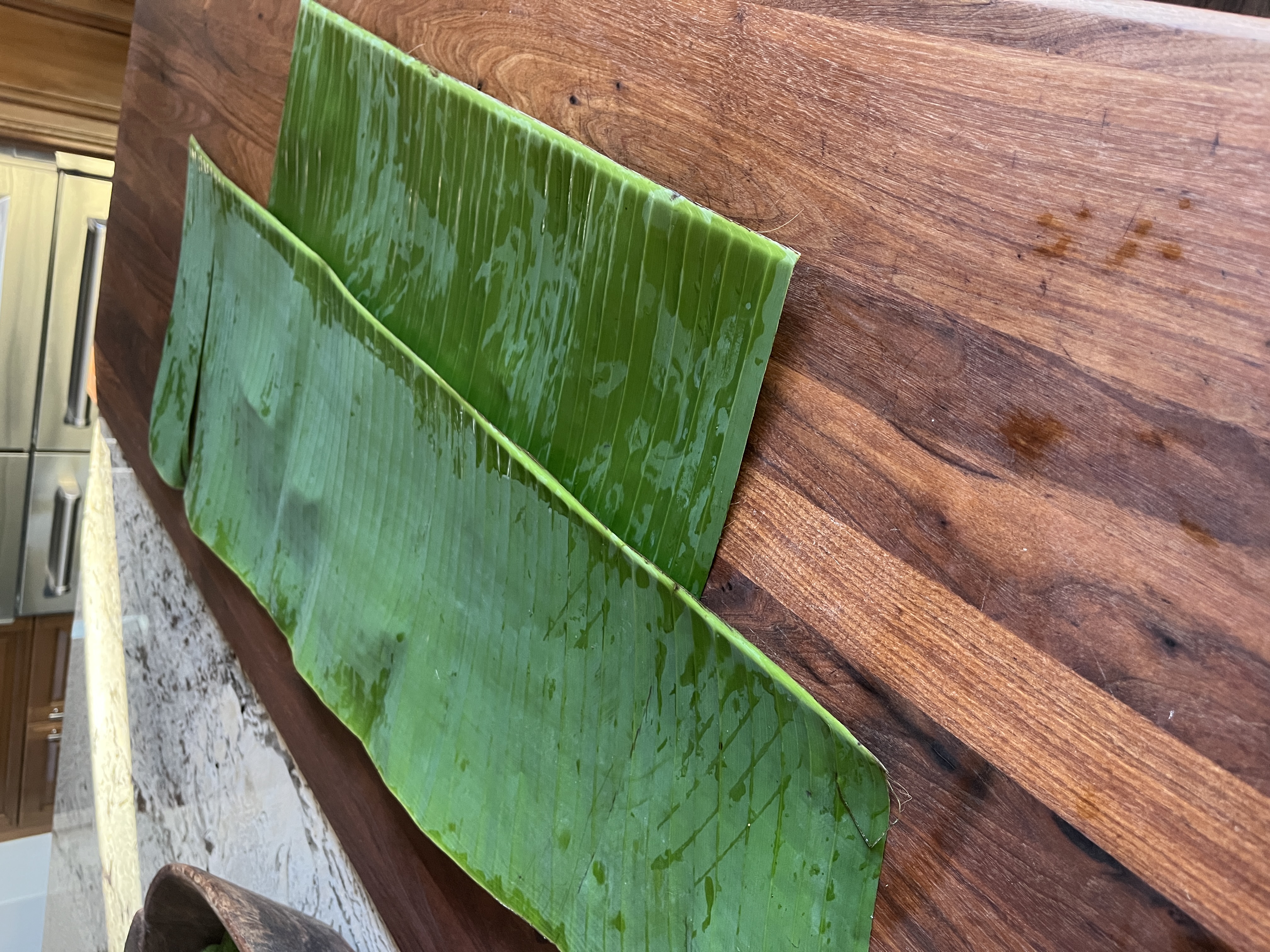 Image of If using fresh banana leaves, place over a low flame...