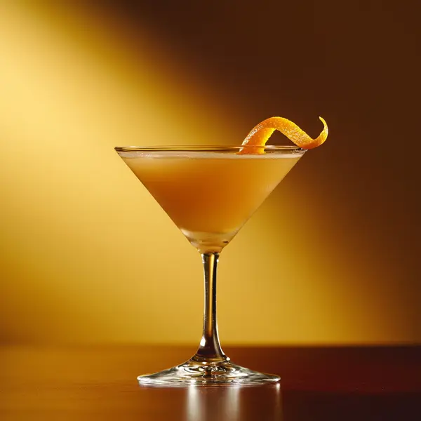 A photo of the Banana Highlander cocktail containing Compass Box Great King Street Artist's Blend Scotch, Giffard Triple Sec, Giffard Banane du Brésil Liqueur, Chilled water (reduce if wet ice) in a Martini.