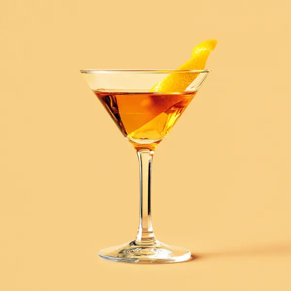 A photo of the The Amber Whisper cocktail containing Beefeater London Dry Gin, Dubonnet Rouge, Freshly squeezed lemon juice, Chartreuse Yellow in a Martini.