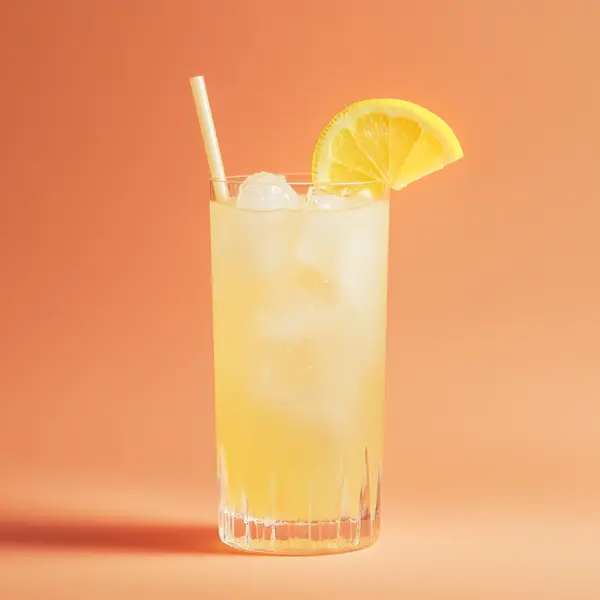 A photo of the Mango Collins cocktail containing Beefeater London Dry Gin, Mango purée, Freshly squeezed lemon juice, Club soda in a Collins.