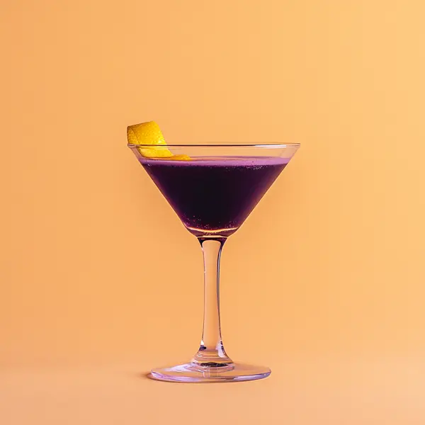 A photo of the Violet Russian cocktail containing Ketel One Vodka, Giffard Crème de Violette Liqueur, Romana Black Sambuca Liqueur, Freshly squeezed lemon juice in a Martini.