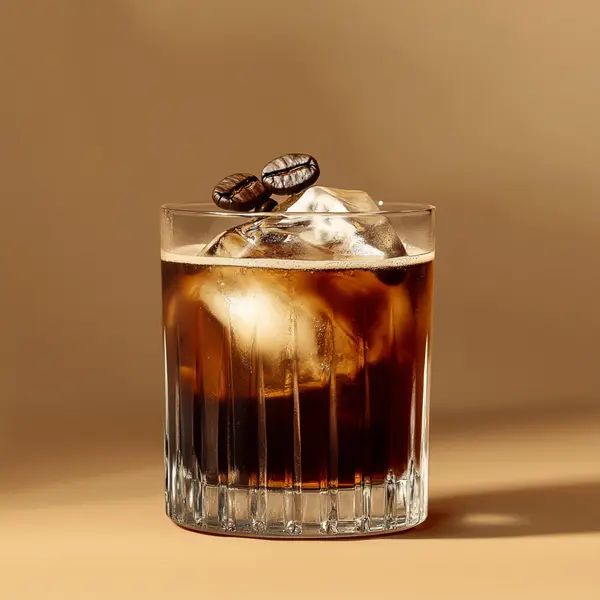 A photo of the Irish Coffee Cooler cocktail containing Ketel One Vodka, Bailey's Irish Cream, Mr Black Cold Brew Coffee Liqueur in a Old-Fashioned.