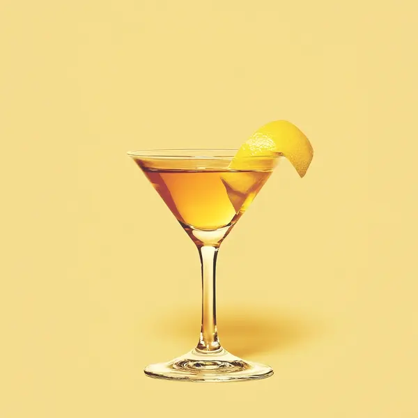 A photo of the Golden Charmer cocktail containing Hennessy V.S. Cognac, Drambuie Liqueur, Freshly squeezed lemon juice, Chilled water (reduce if wet ice) in a Martini.