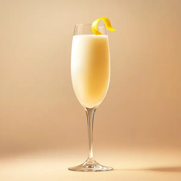 A photo of the Frosty Fizz cocktail containing Ketel One Vodka, Single cream / half-and-half, La Marca Prosecco, Lemon sorbet in a Flute.