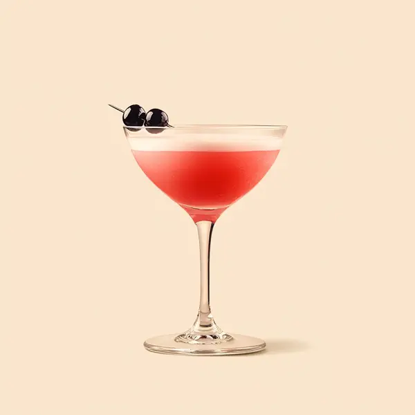 A photo of the Cosmic Currant cocktail containing Ketel One Vodka, LEJAY LAGOUTE Crème de Cassis, Freshly squeezed pink grapefruit juice in a Martini.
