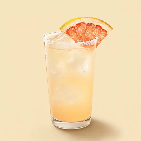 A photo of the Grapefruit Groove cocktail containing Patron Silver Tequila, Freshly squeezed lime juice, Three Cents Pink Grapefruit Soda in a Collins.