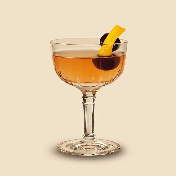 A photo of the Fancy Tom cocktail containing Hayman's Old Tom Gin, Noilly Prat Dry Vermouth, Luxardo Maraschino Liqueur, Pernod Absinthe, Angostura Orange Bitters, Angostura Aromatic Bitters in a Coupe.