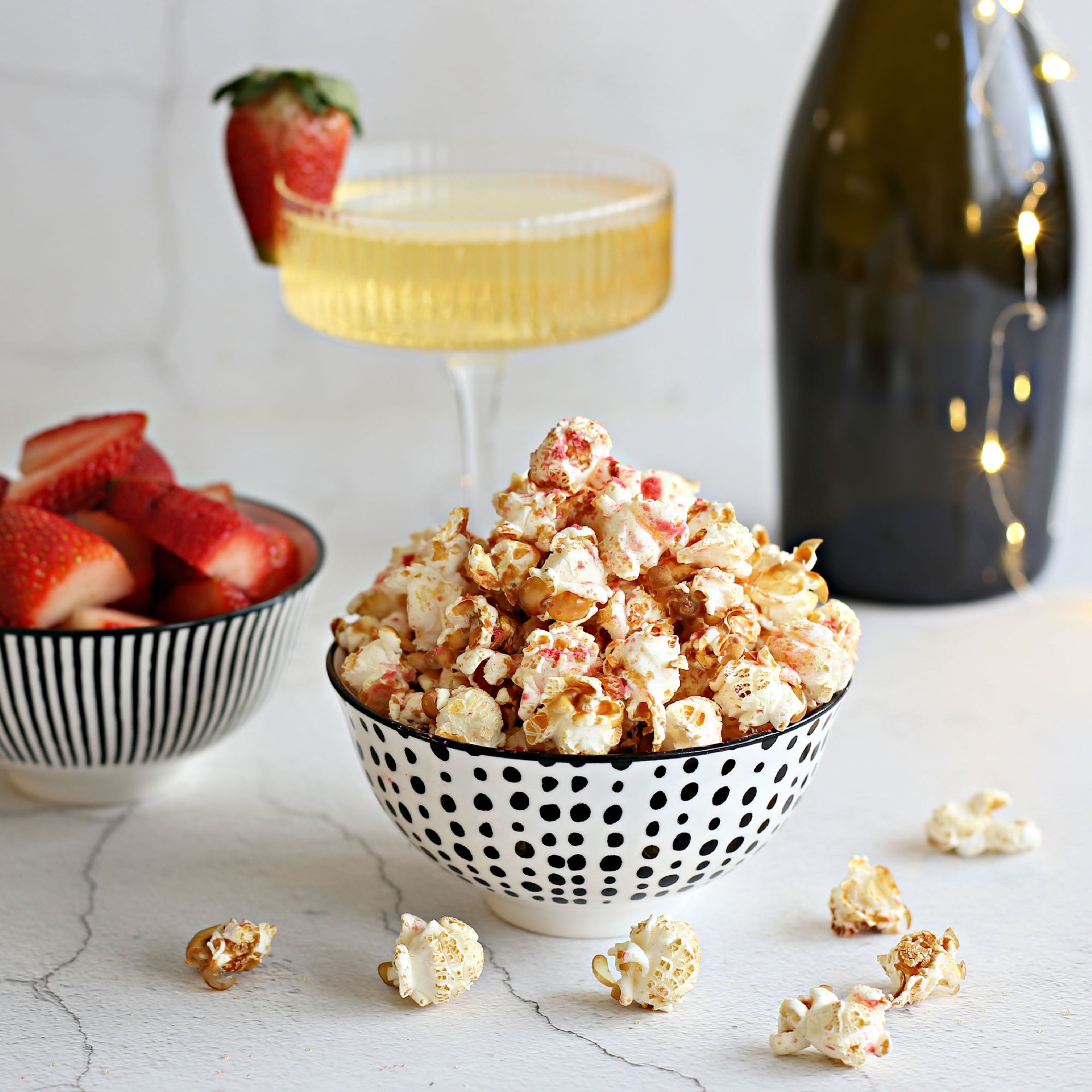 Image of Add the popcorn to the sugar/champagne mixture and toss to...