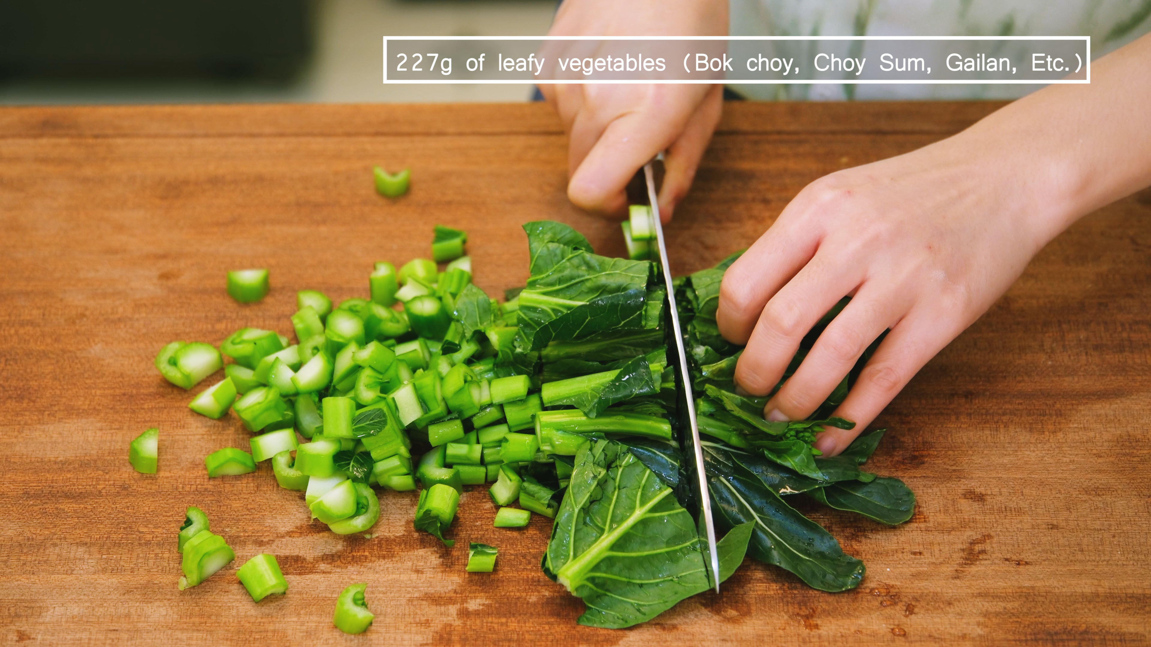 Image of While the jook is simmering, dice some green leafy vegetables,...