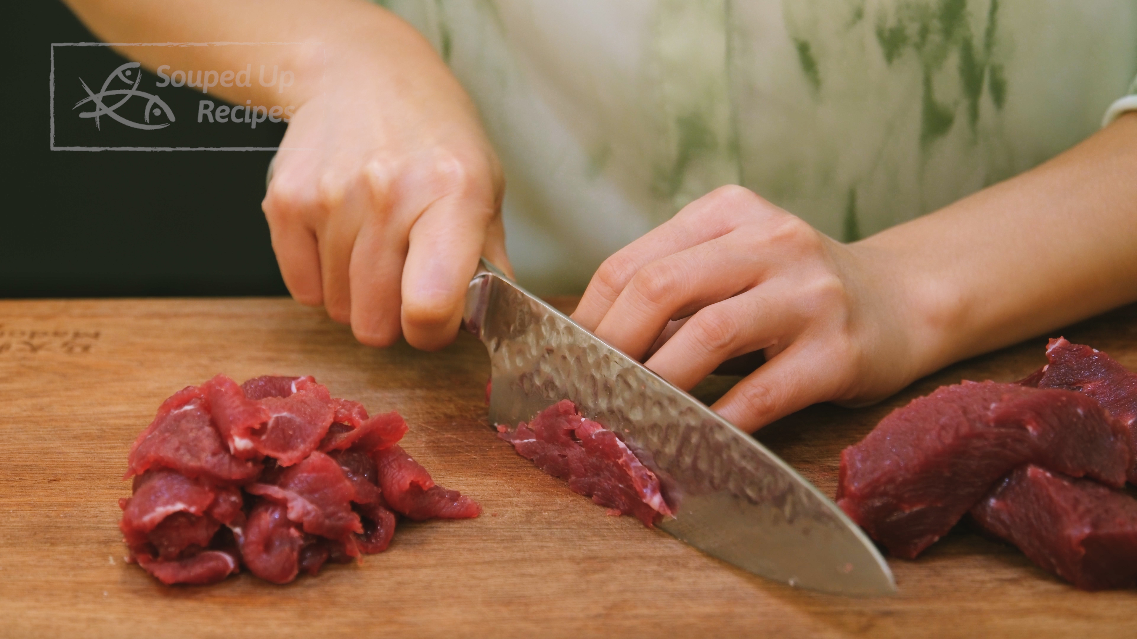 Image of Slice the beef into 1/8 of an inch thick pieces....