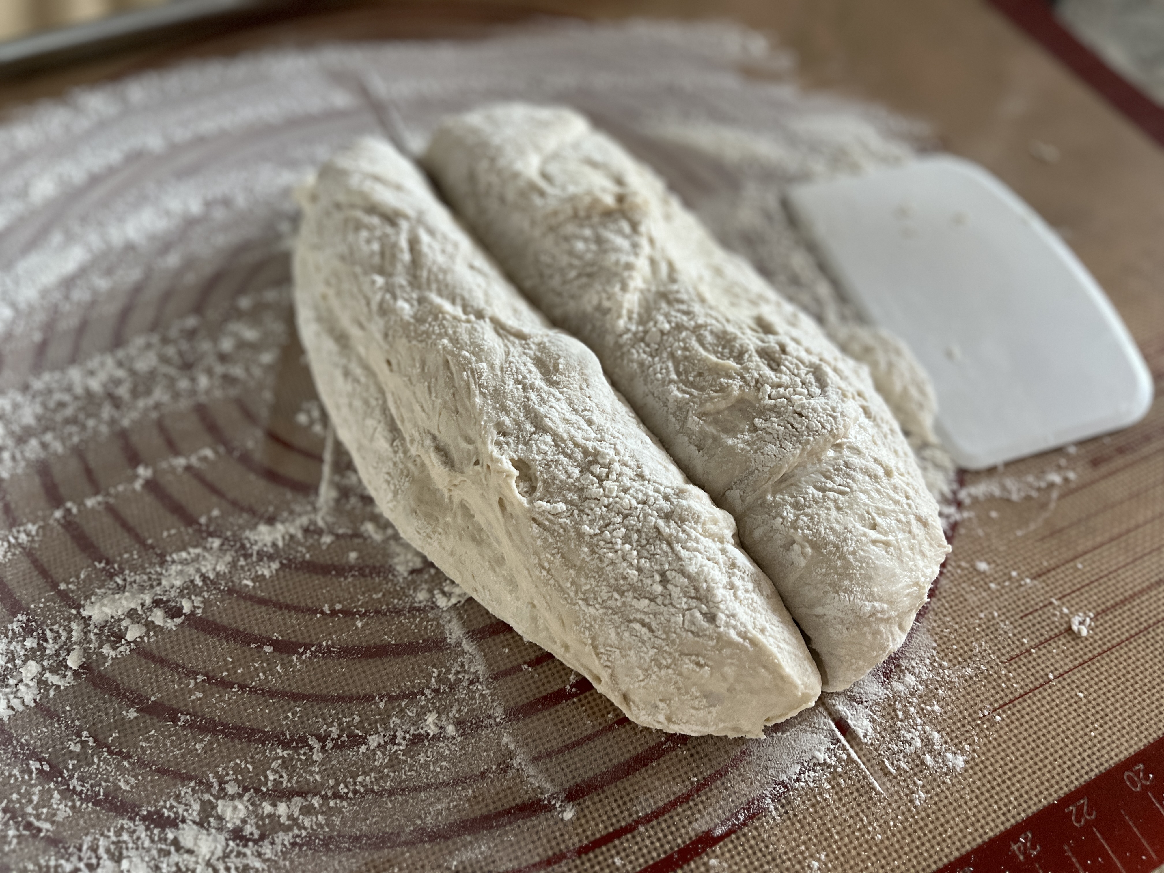 Image of Cut dough into two pieces and form into a long...