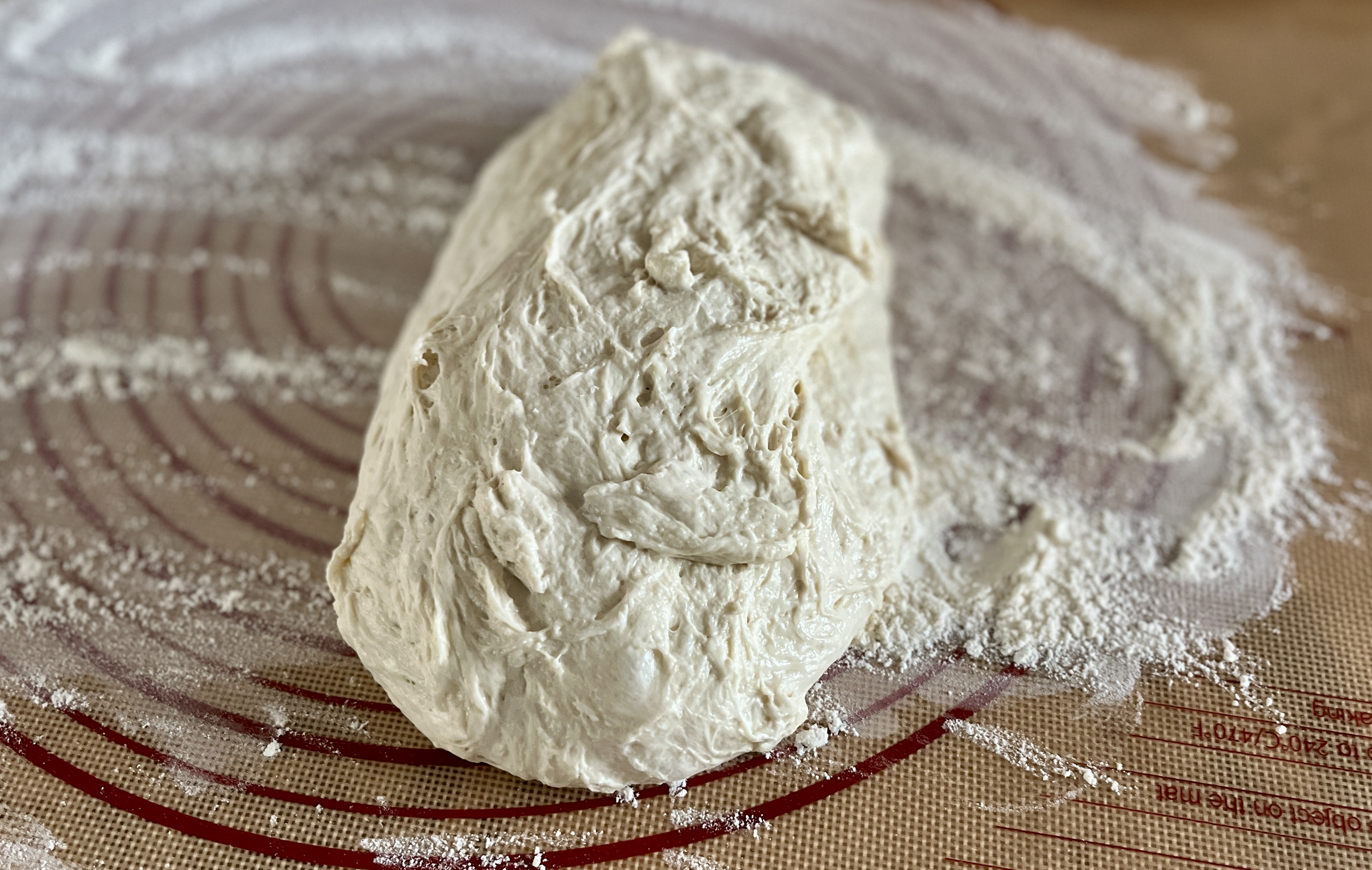 Image of Lightly sprinkle the top of the dough with flour.