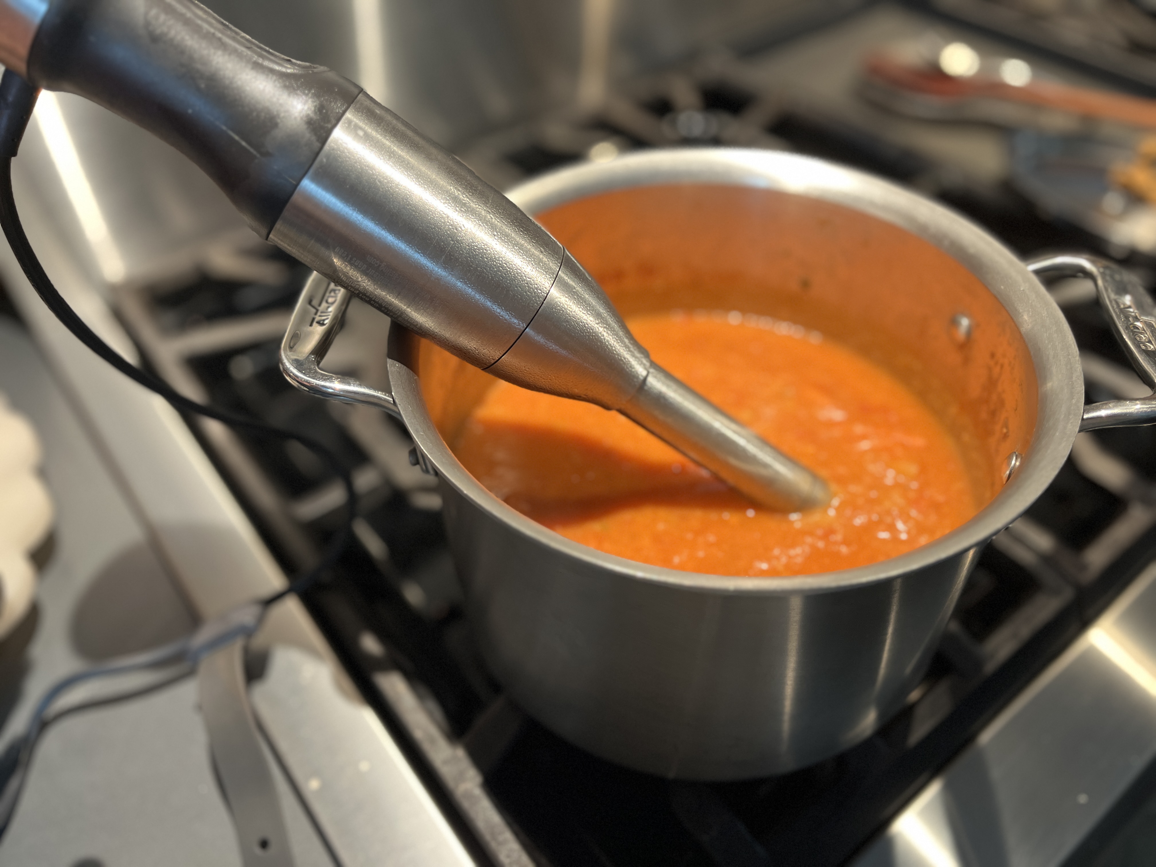 Image of Using a hand immersion blender, blend the soup to desired...
