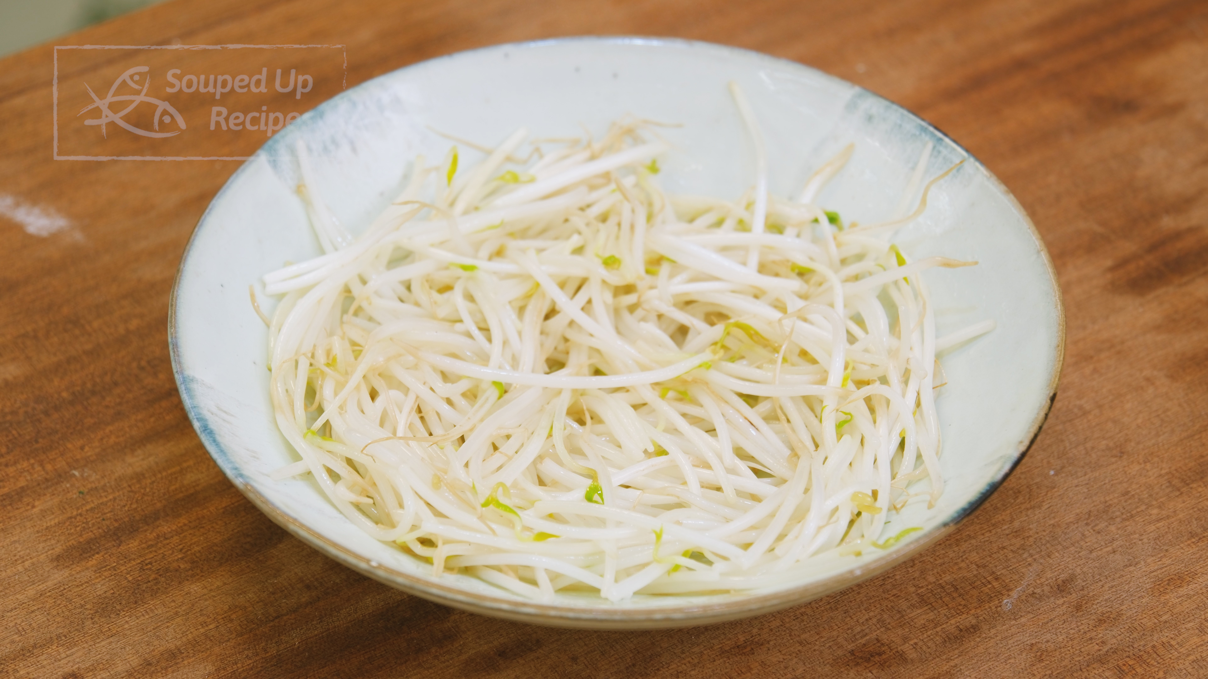 Image of Add a bunch of bean sprouts to the same wok...