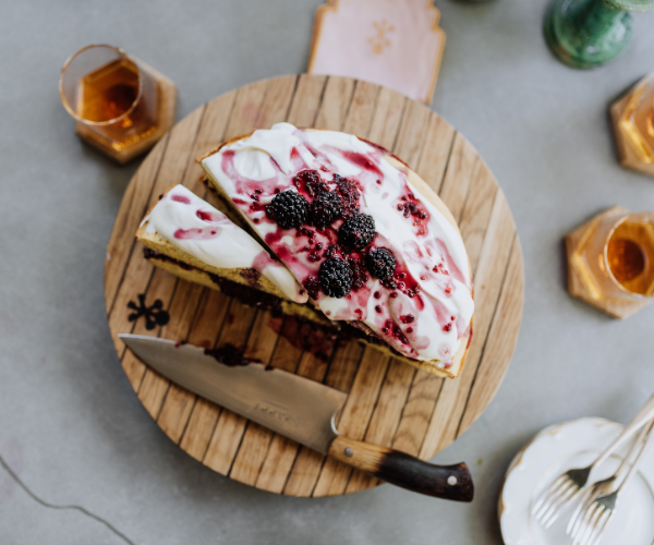 Image of Place the first layer on a cake stand and spread...