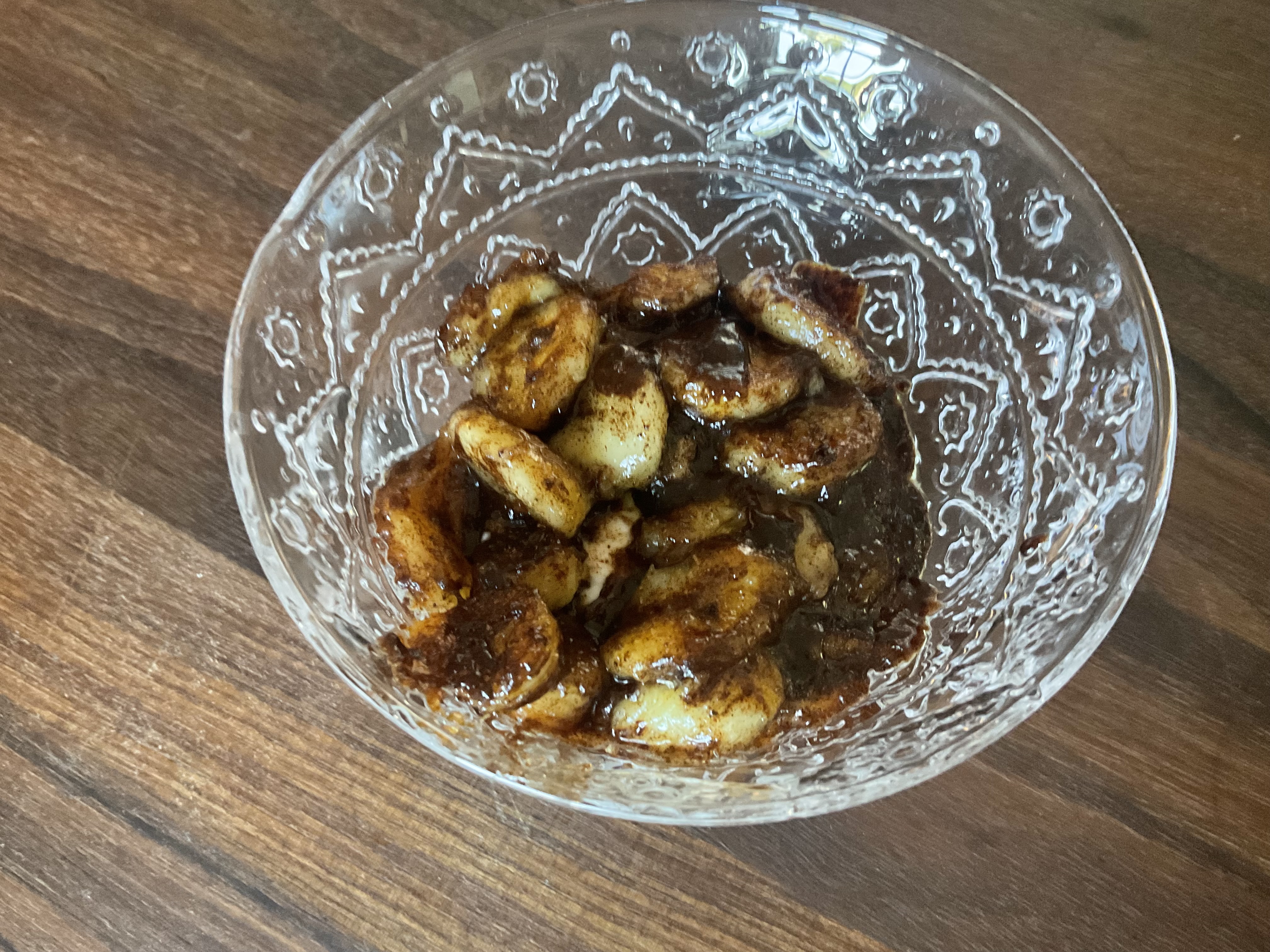 Image of In a bowl, add yogurt and pour the hot banana...