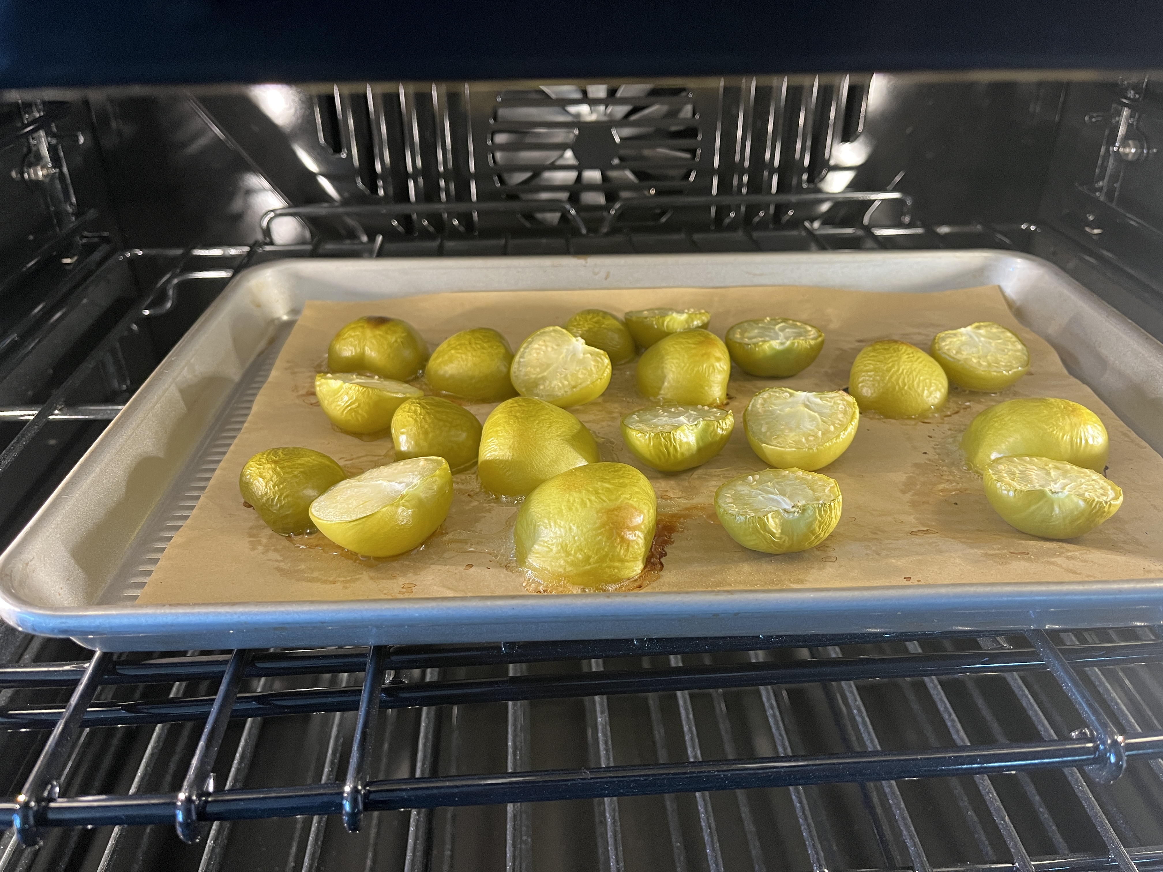 Image of Line a 9x13 cookie sheet with parchment paper. Arrange tomatillos...